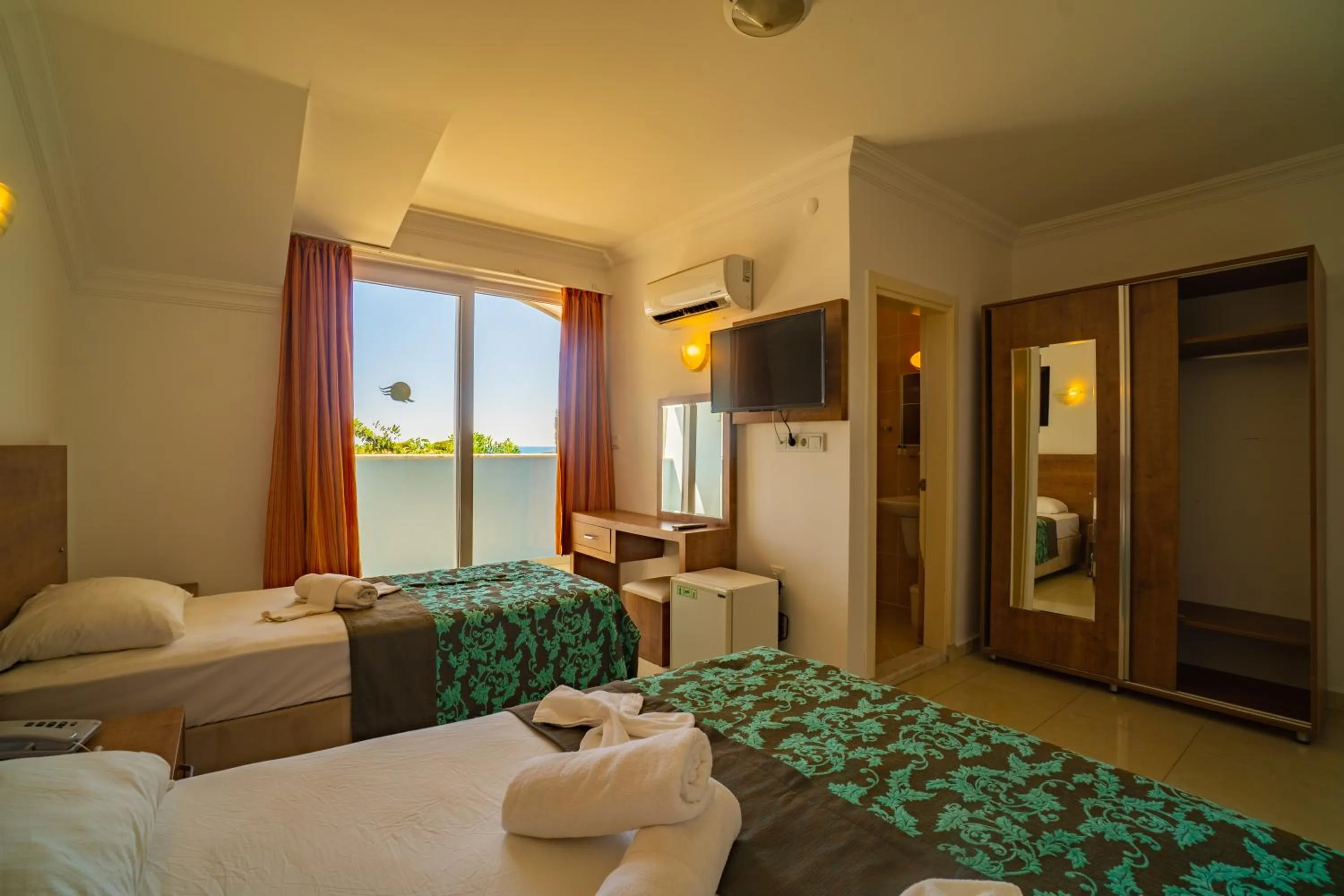 Bed in Prenses Sealine Beach Hotel