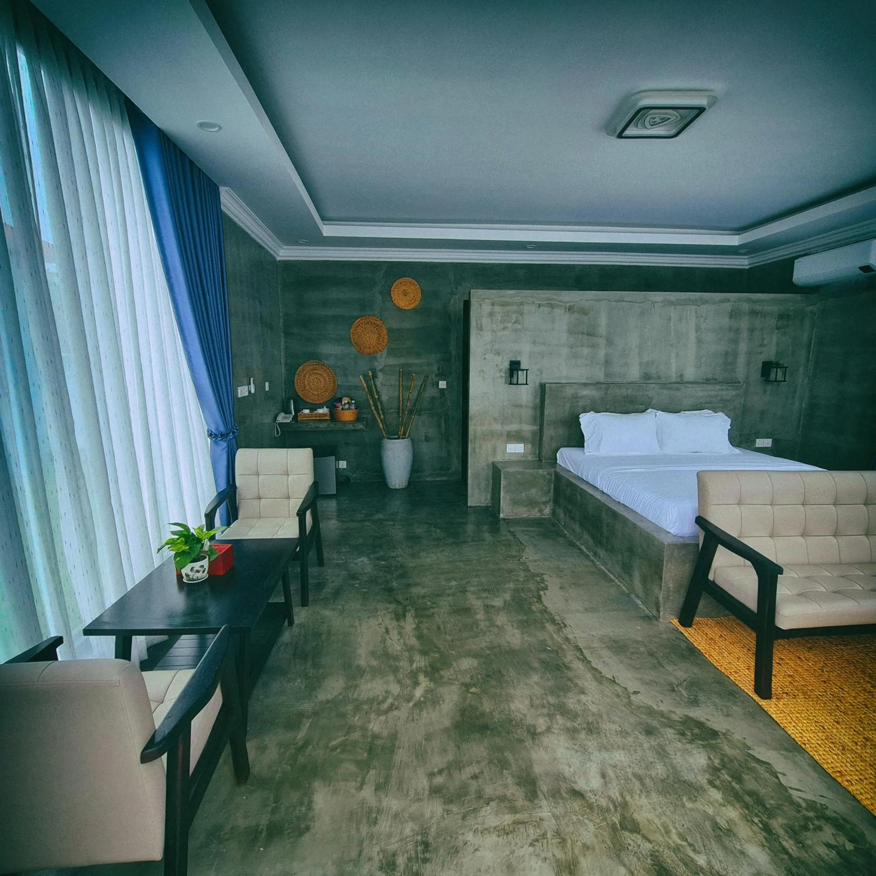 Seating area, Bed in Damnak Borey Resort