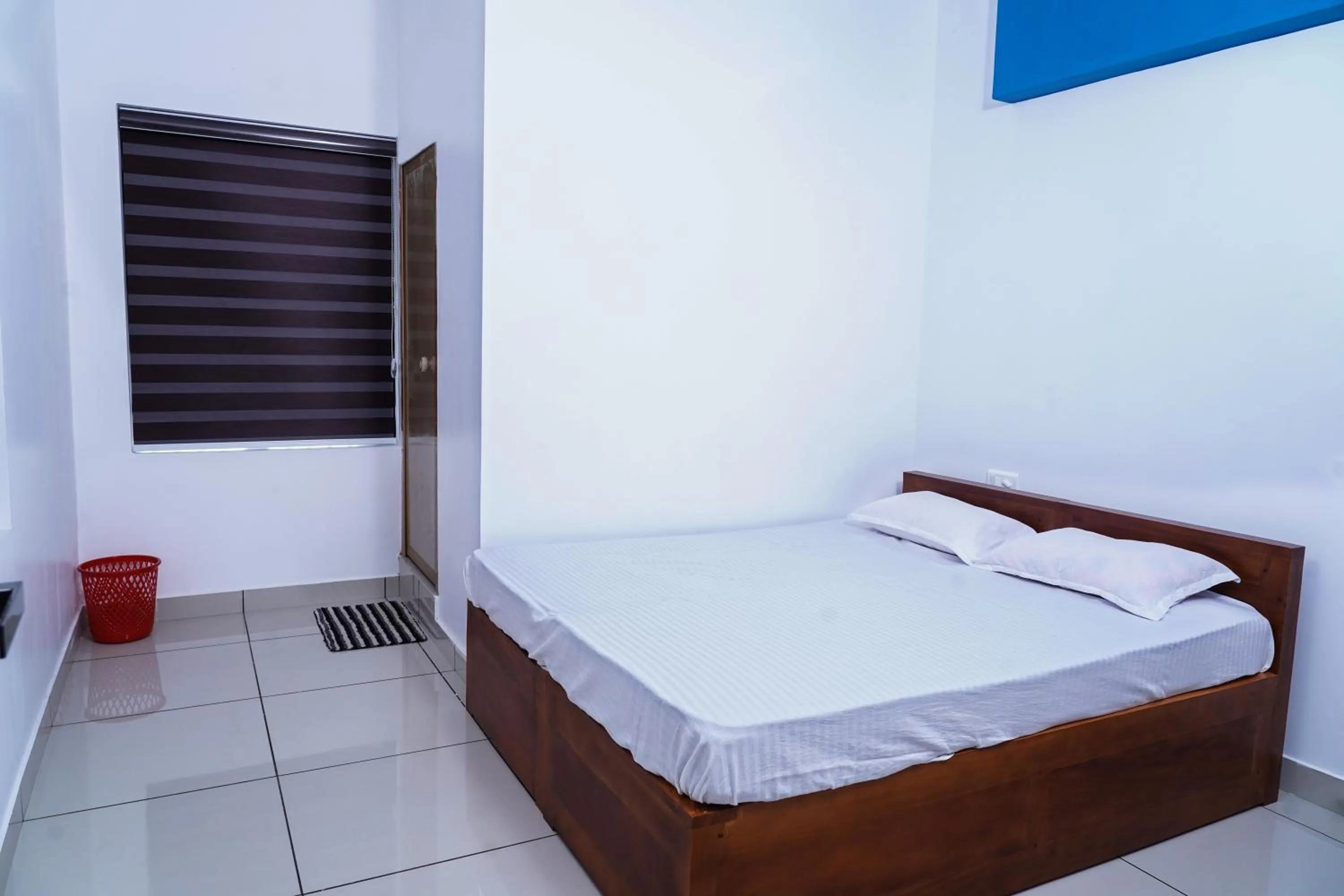 Bedroom, Bed in THEKKUMPURAM RESIDENCY