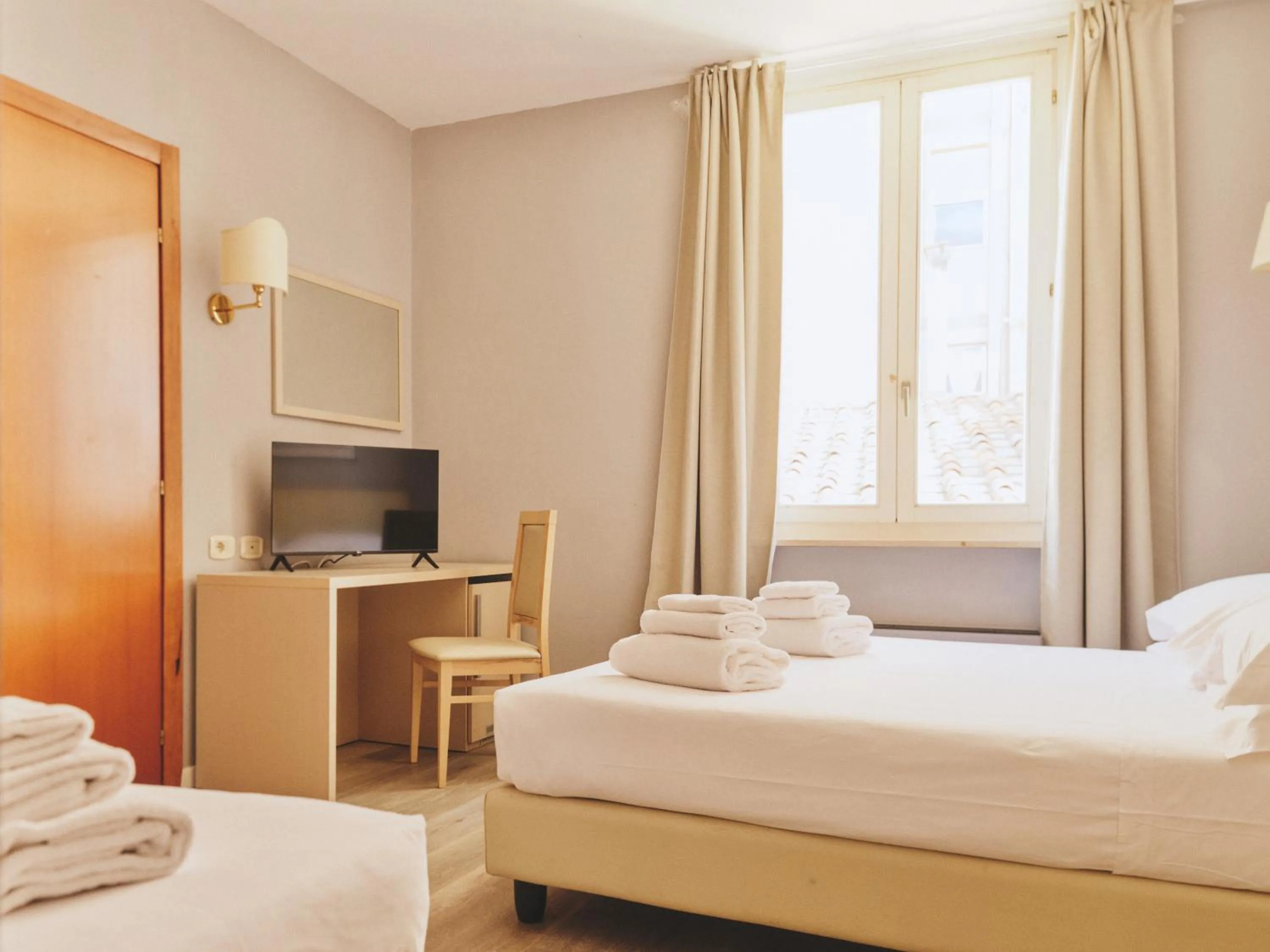 Bed in Hotel L'Aretino