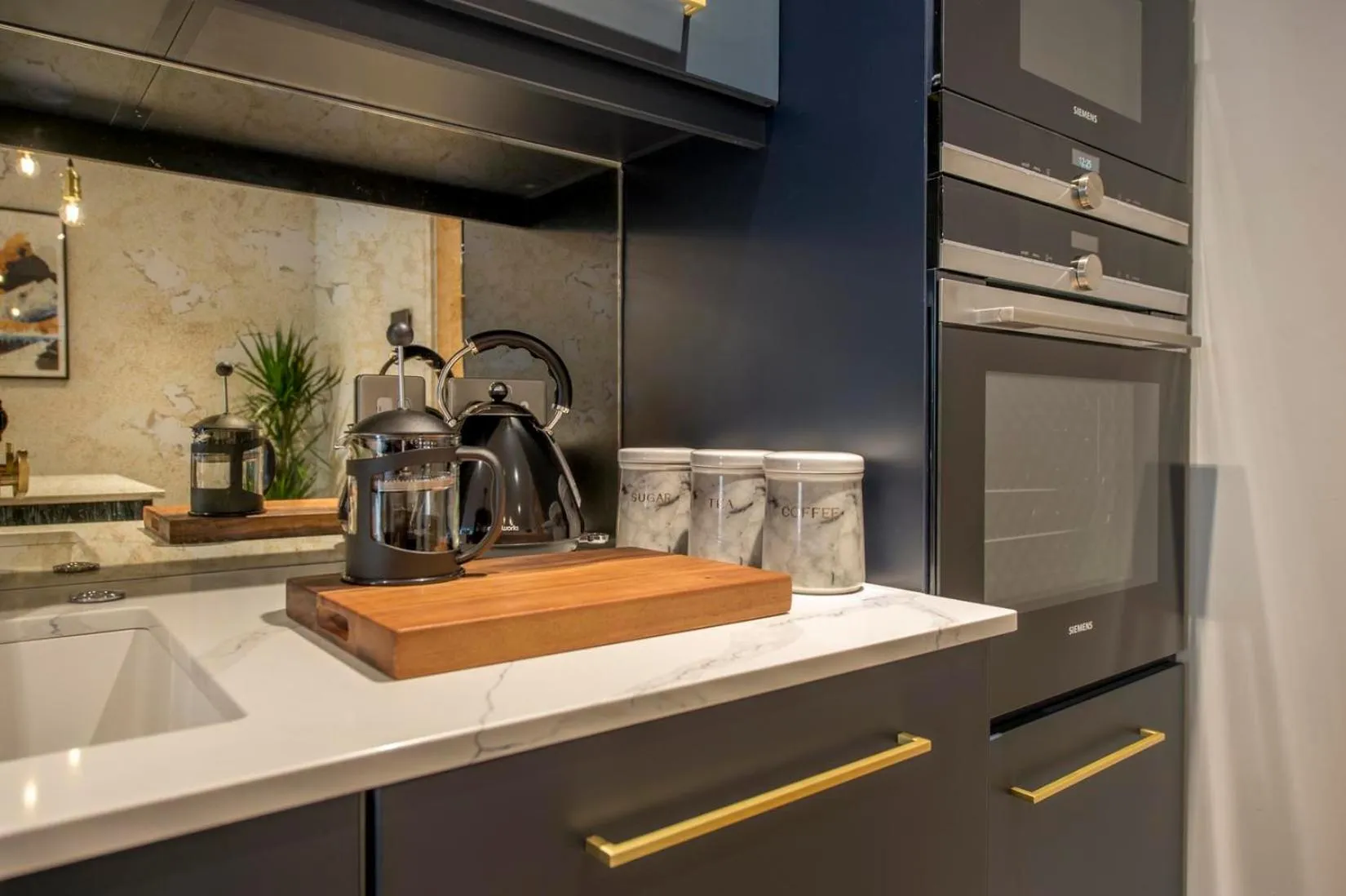 Kitchen or kitchenette in The Quadrant - The Botanical Suite