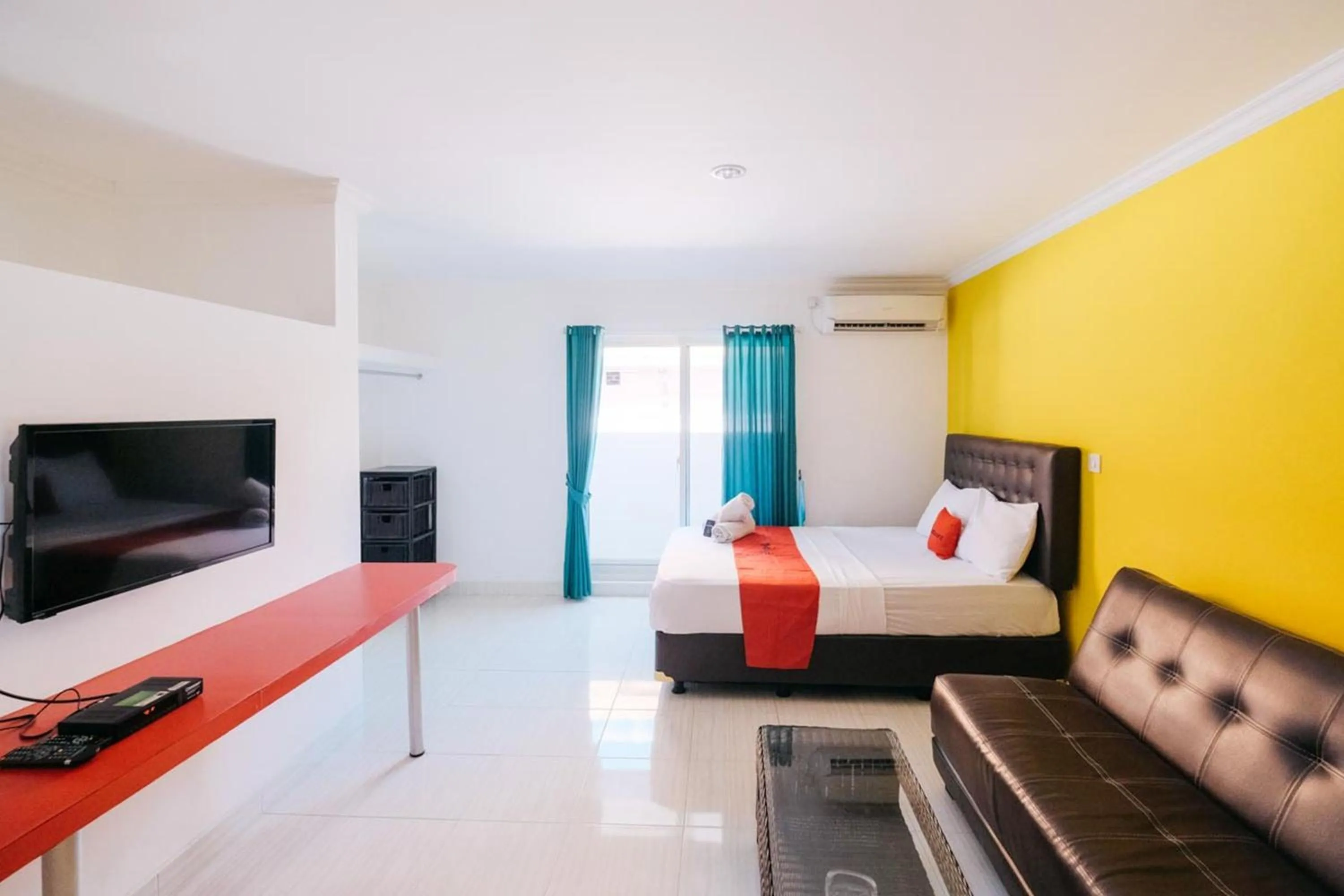 TV and multimedia in RedDoorz at Kawaii Apartment Jimbaran