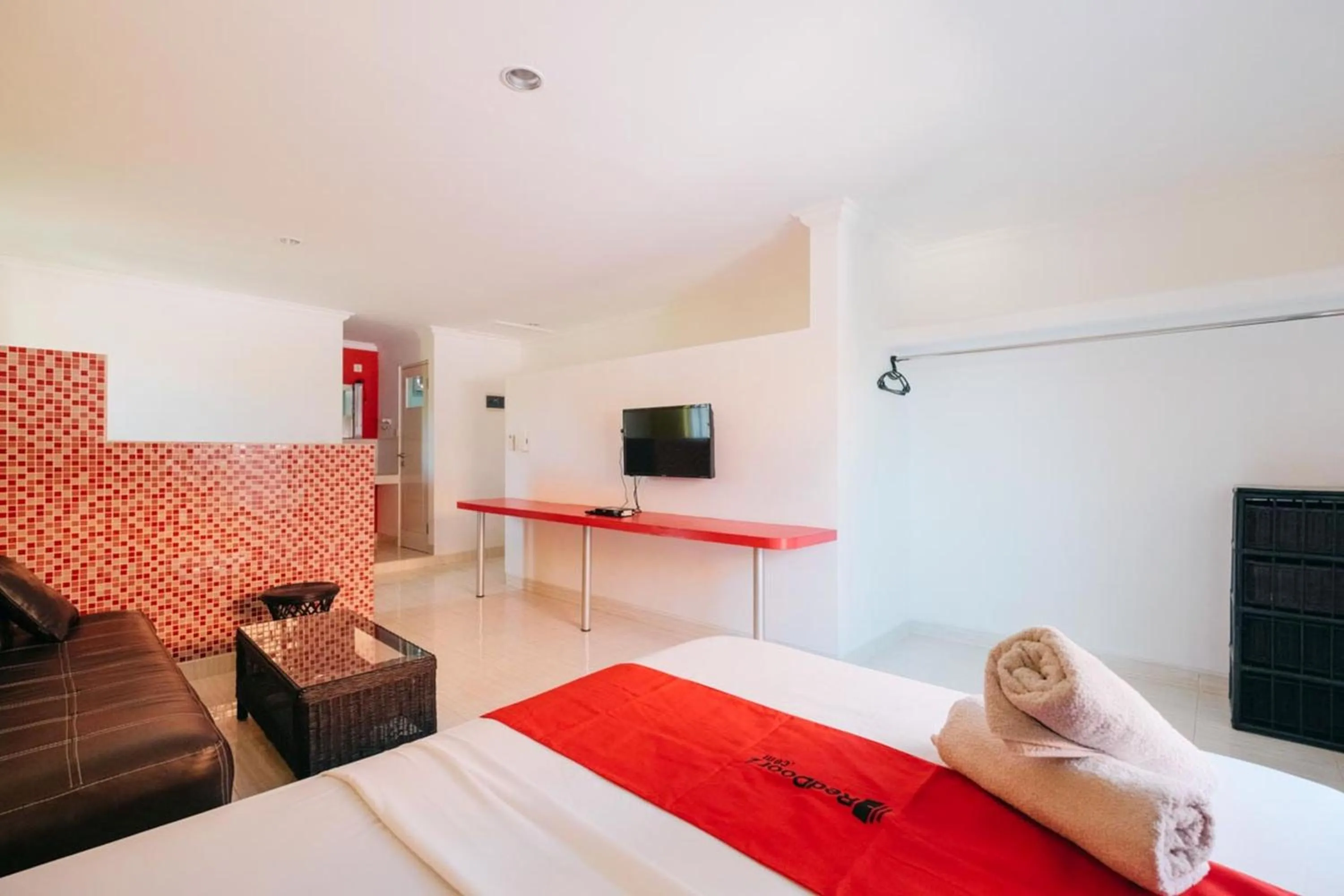 TV and multimedia in RedDoorz at Kawaii Apartment Jimbaran