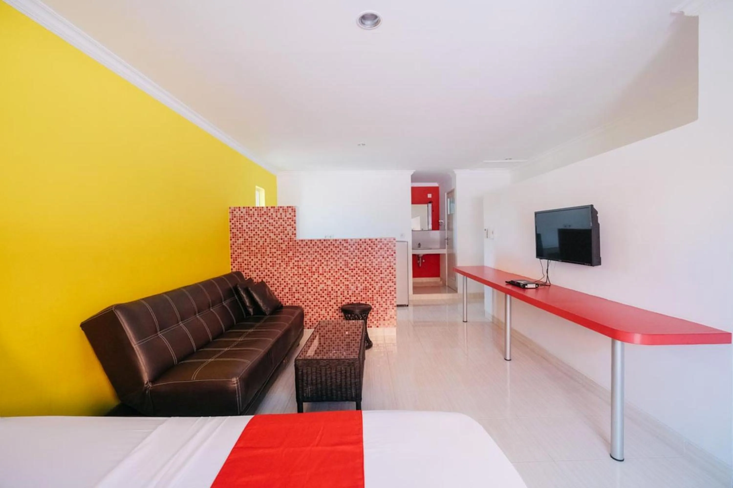 TV and multimedia in RedDoorz at Kawaii Apartment Jimbaran