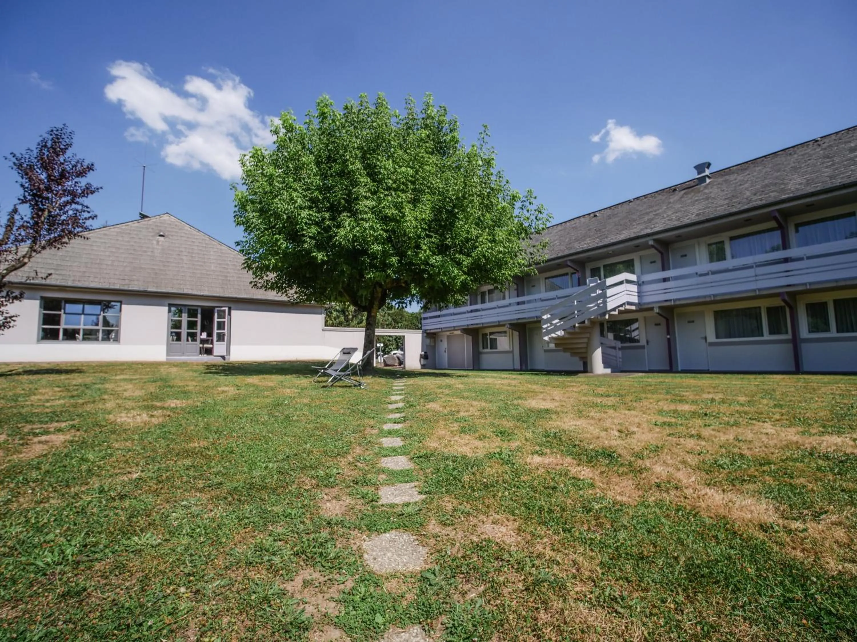 Property building in Hôtel Inn Design Resto Novo Sablé