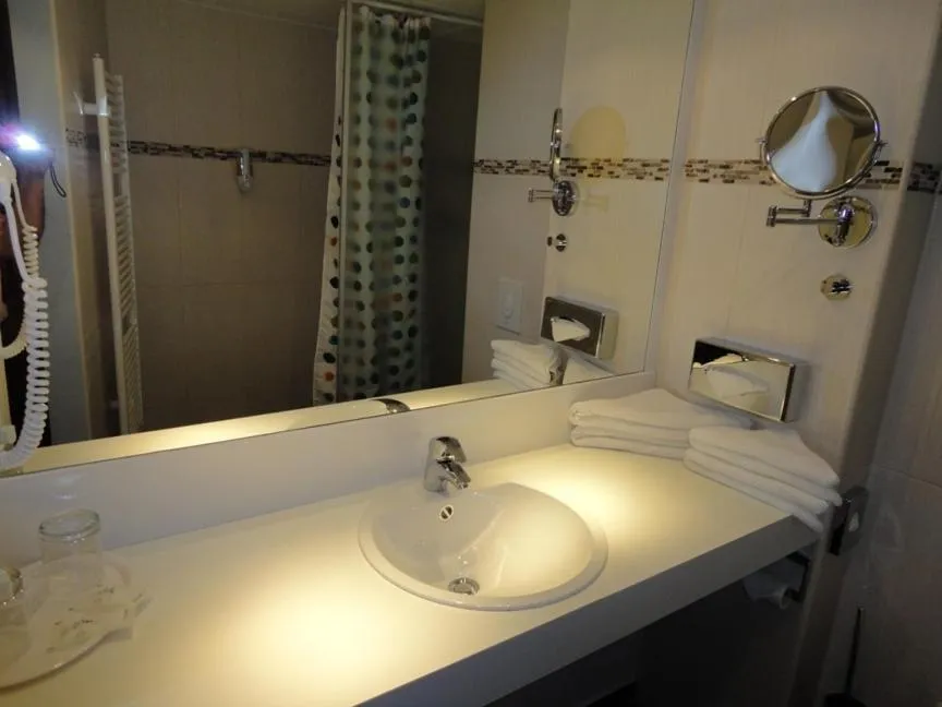 Bathroom in Grand Hotel Dream Main City Center