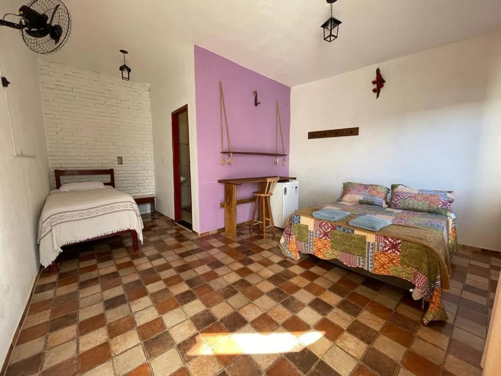 Property building, Bed in Pousada Rosa Mistica