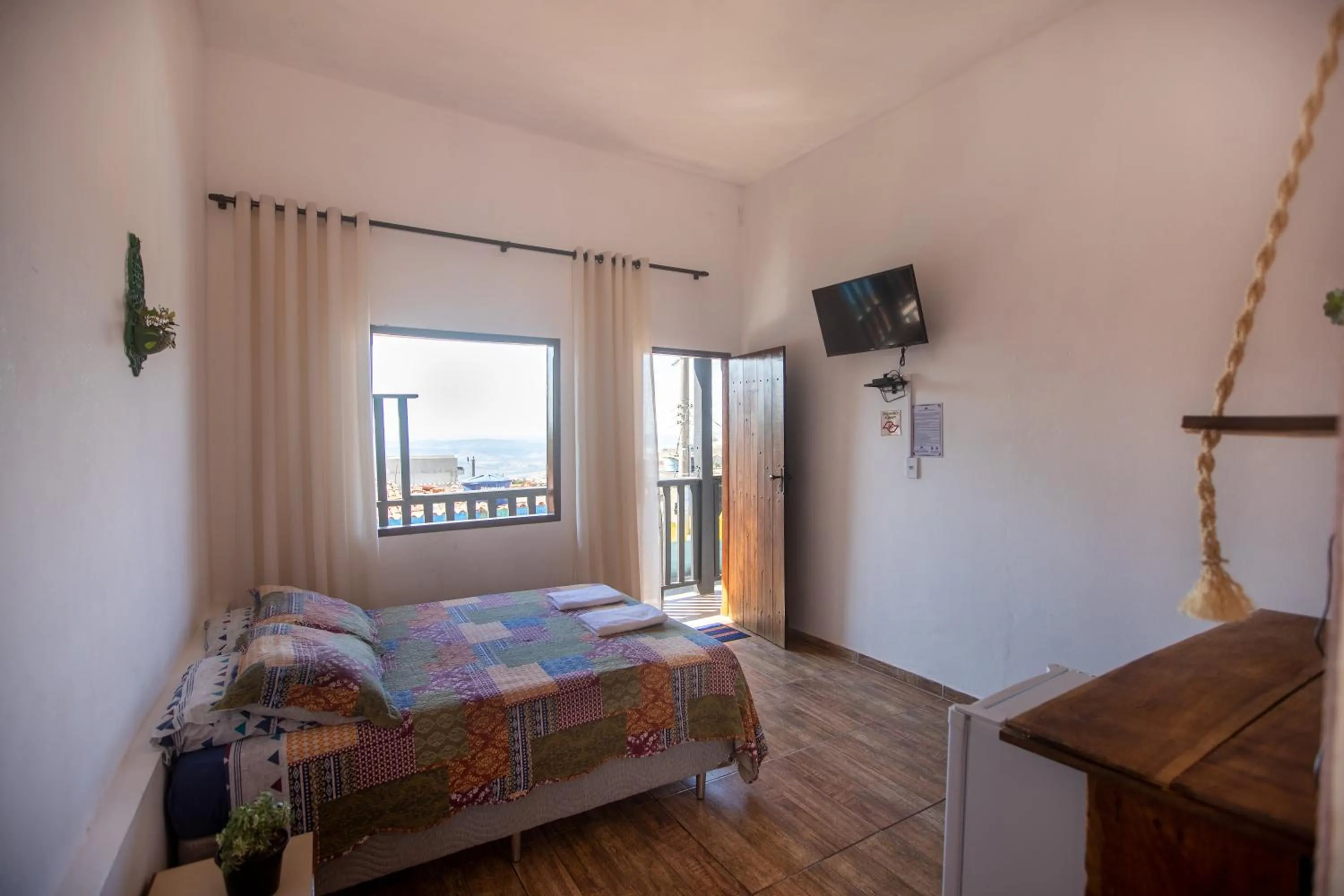 Photo of the whole room, Bed in Pousada Rosa Mistica