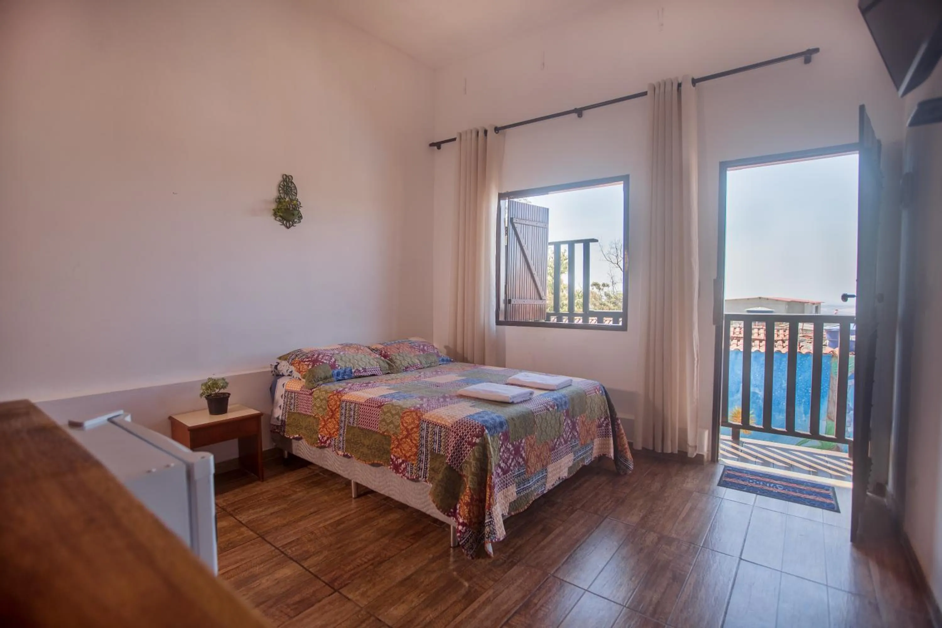 View (from property/room), Bed in Pousada Rosa Mistica