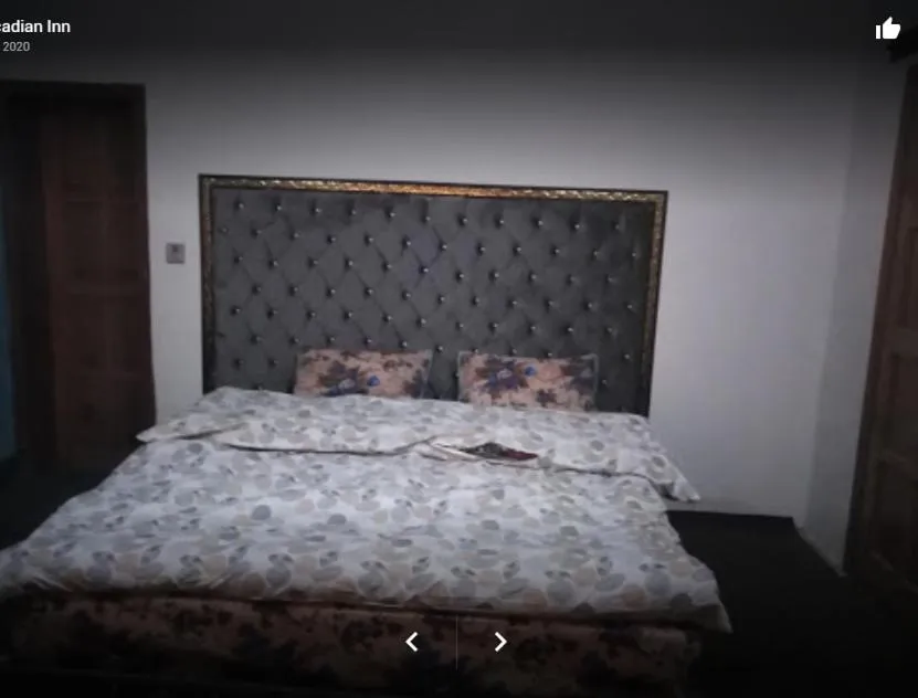 Bed in Arcadian Inn Hotel
