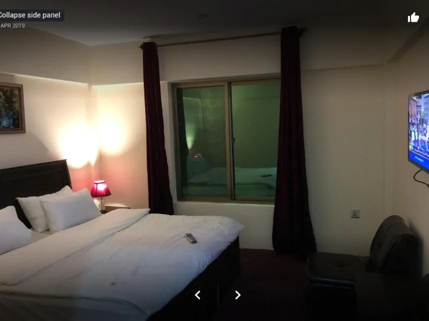 Bed in Arcadian Inn Hotel