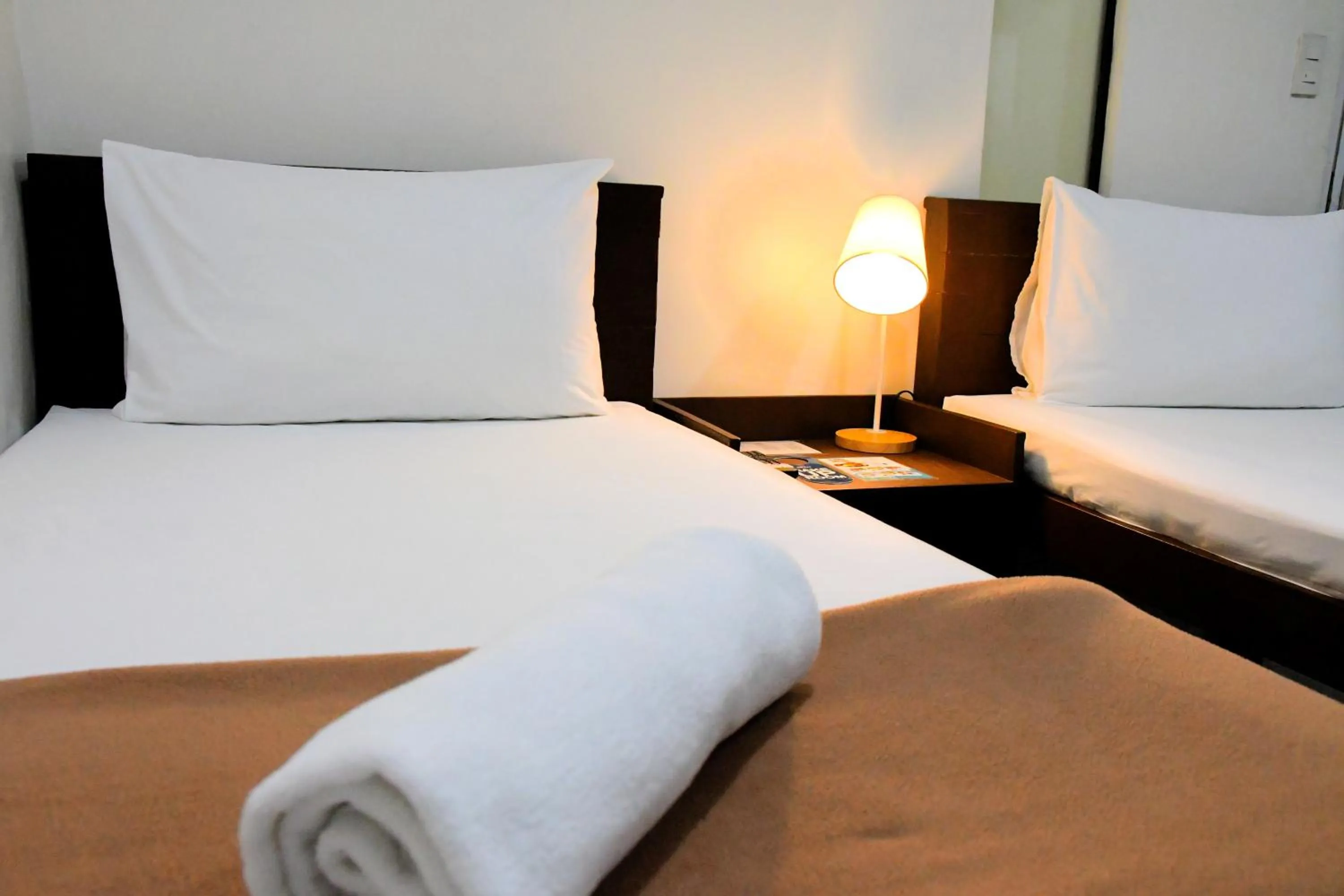 Bed in Arzo Hotel Makati
