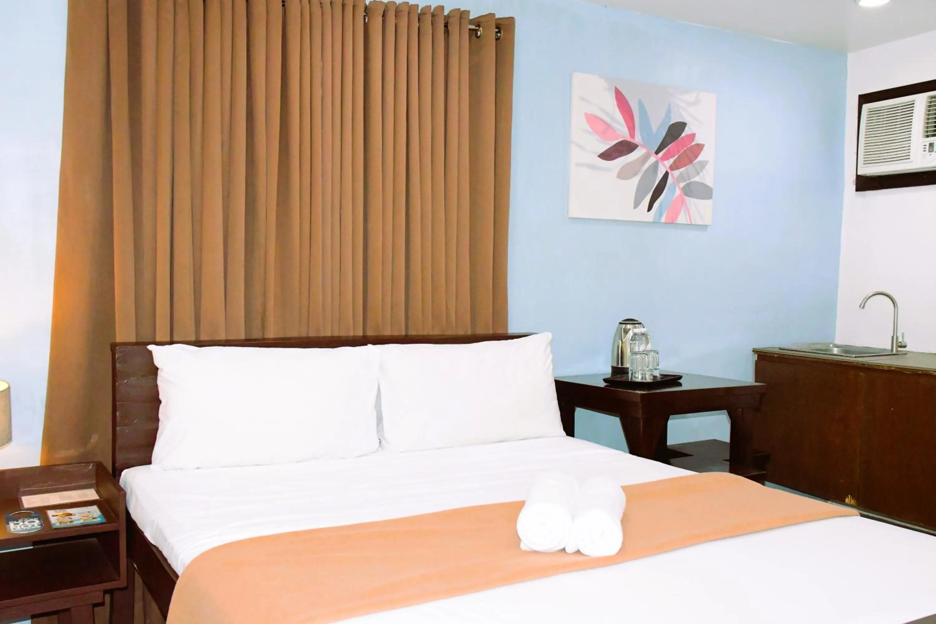 Bed in Arzo Hotel Makati