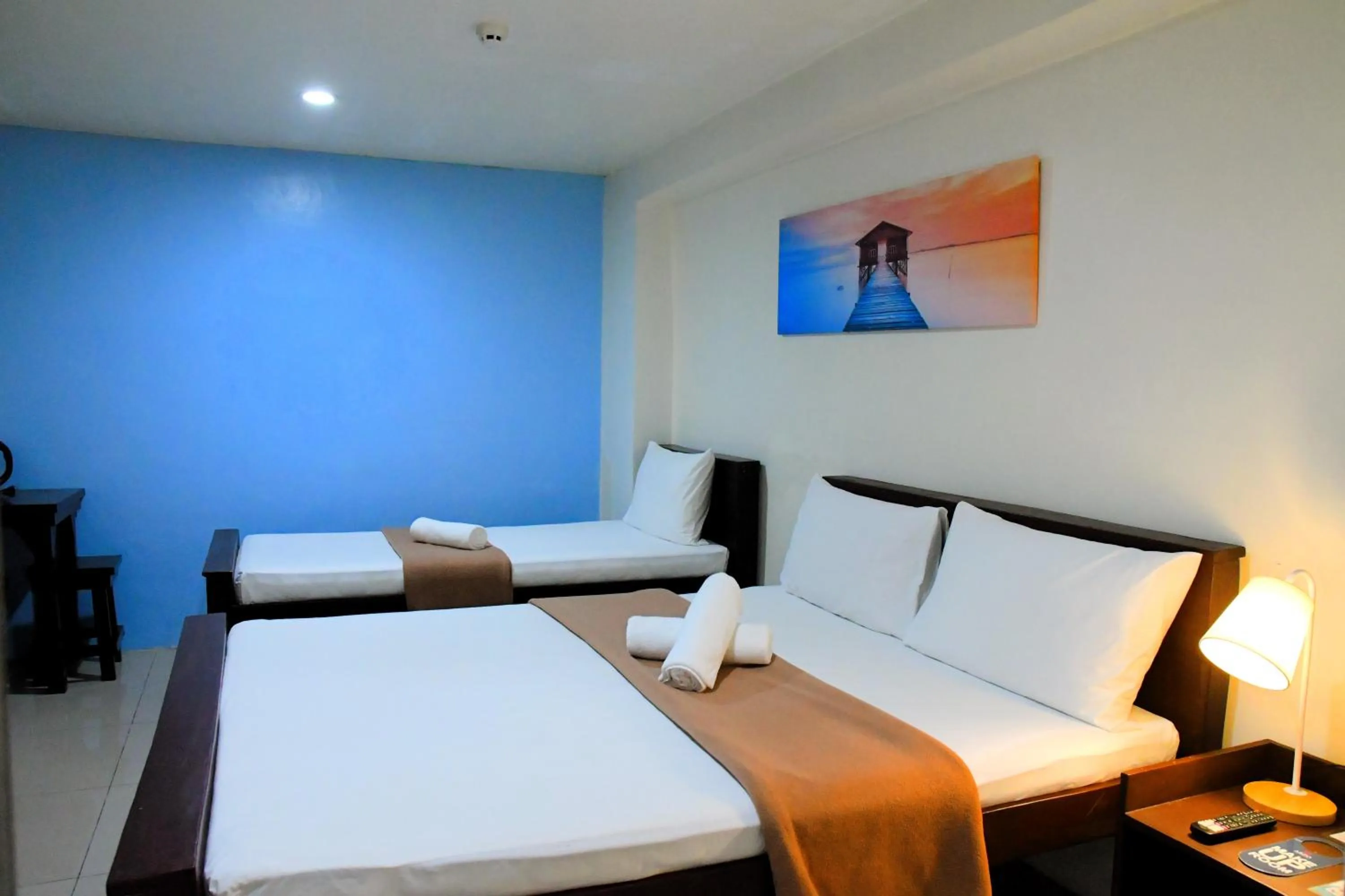 Bed in Arzo Hotel Makati