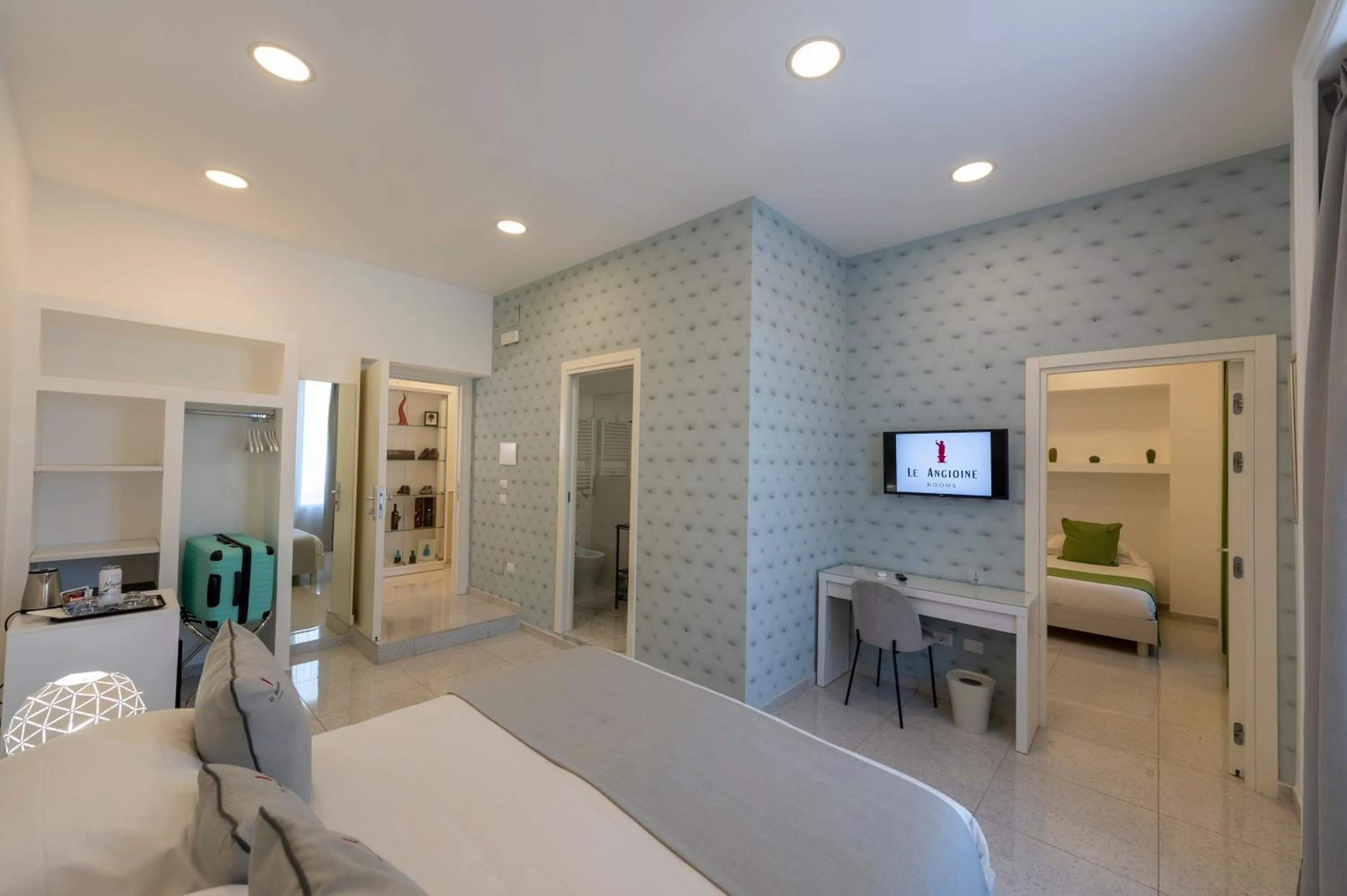 Bed in Le Angioine Rooms