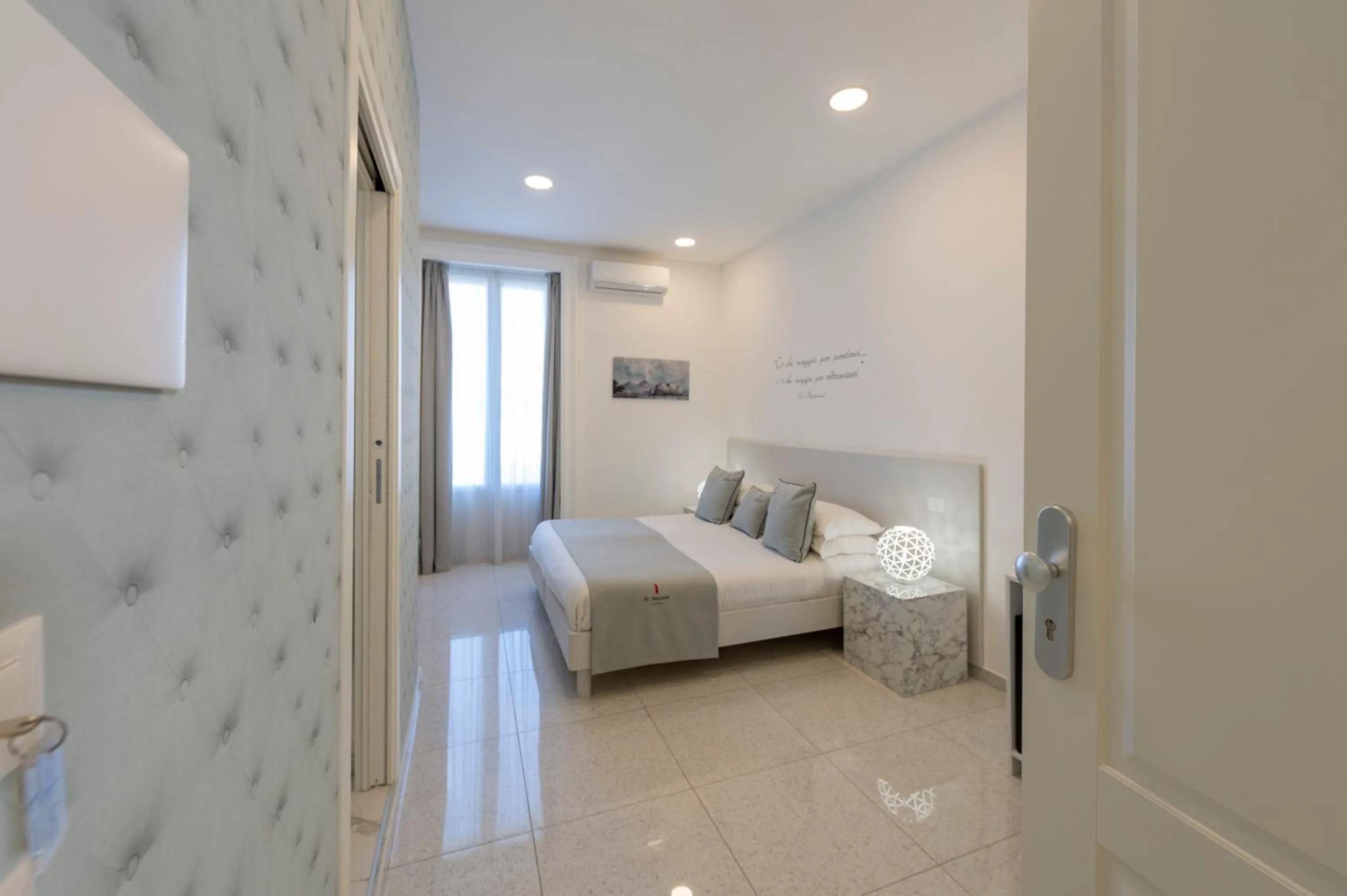 Bed in Le Angioine Rooms