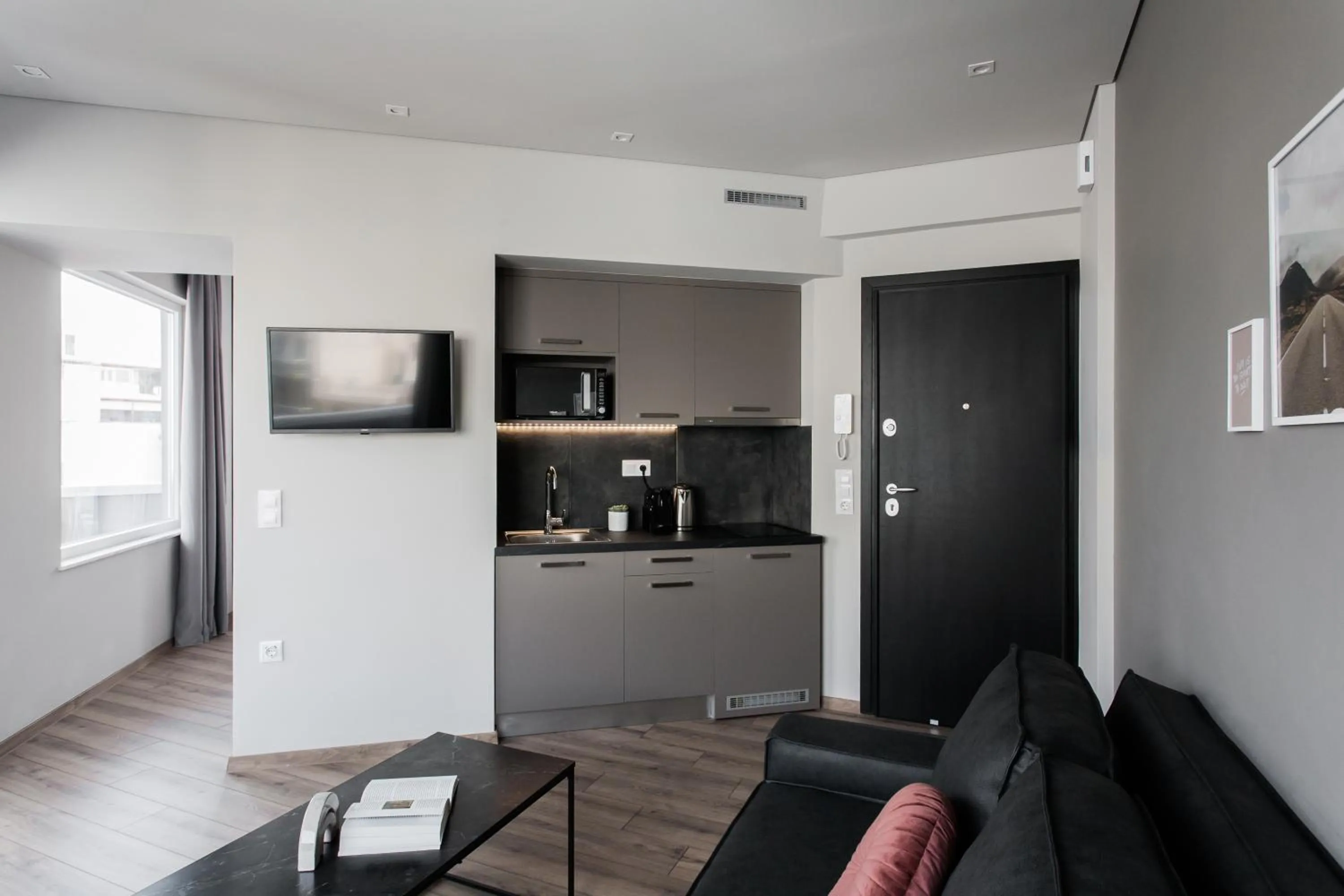 TV and multimedia in WYZ Athens Apartments by UPSTREET