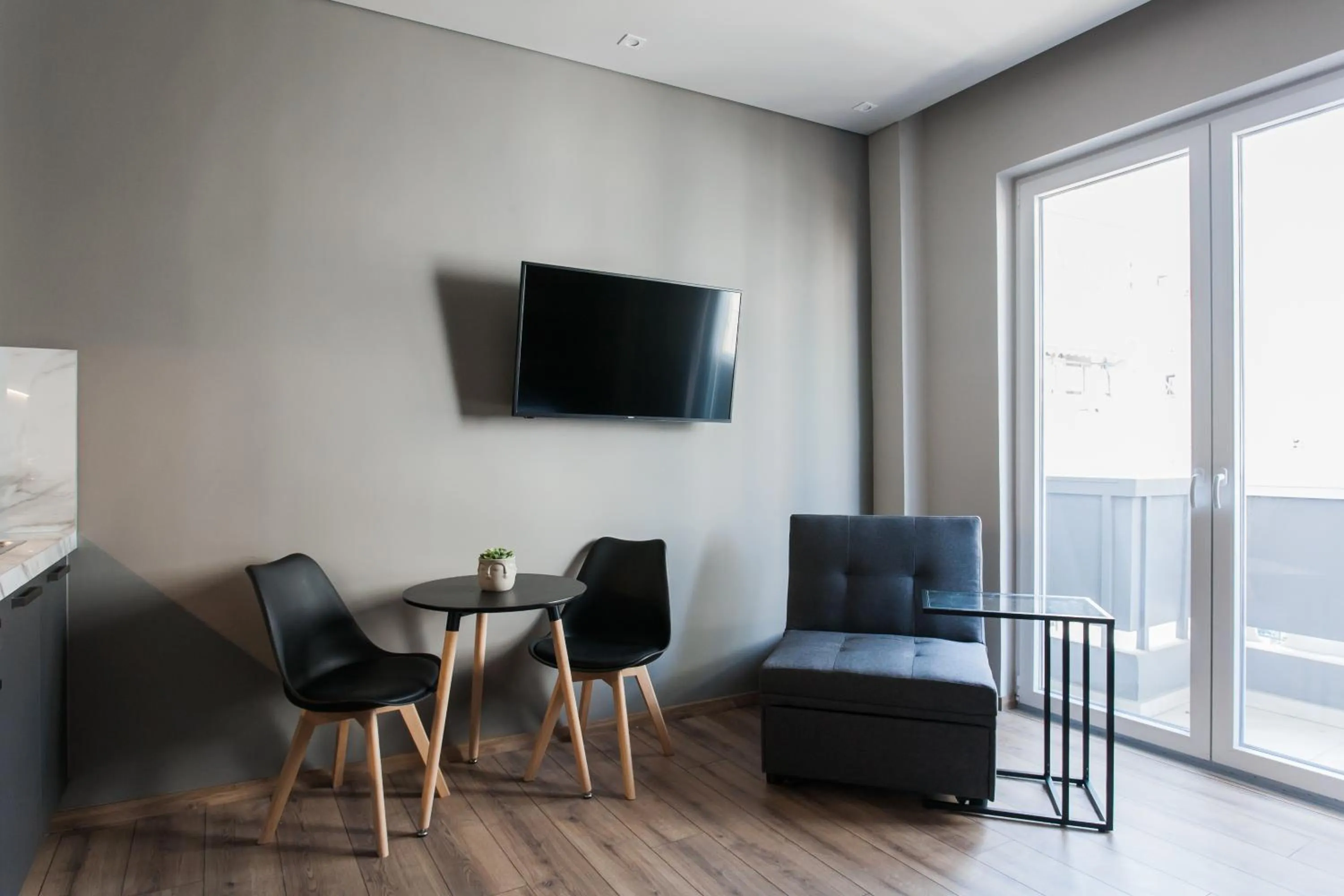 Seating area in WYZ Athens Apartments by UPSTREET