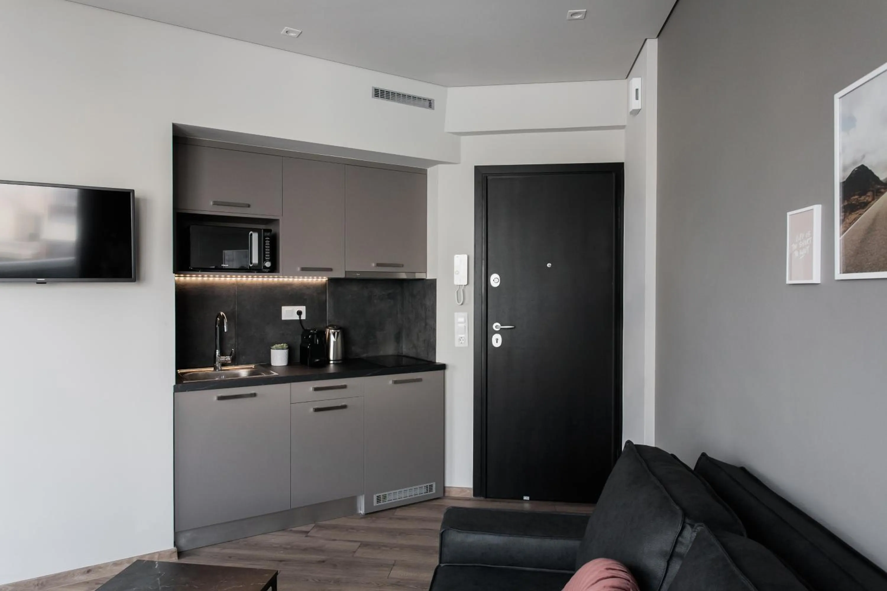 TV and multimedia in WYZ Athens Apartments by UPSTREET