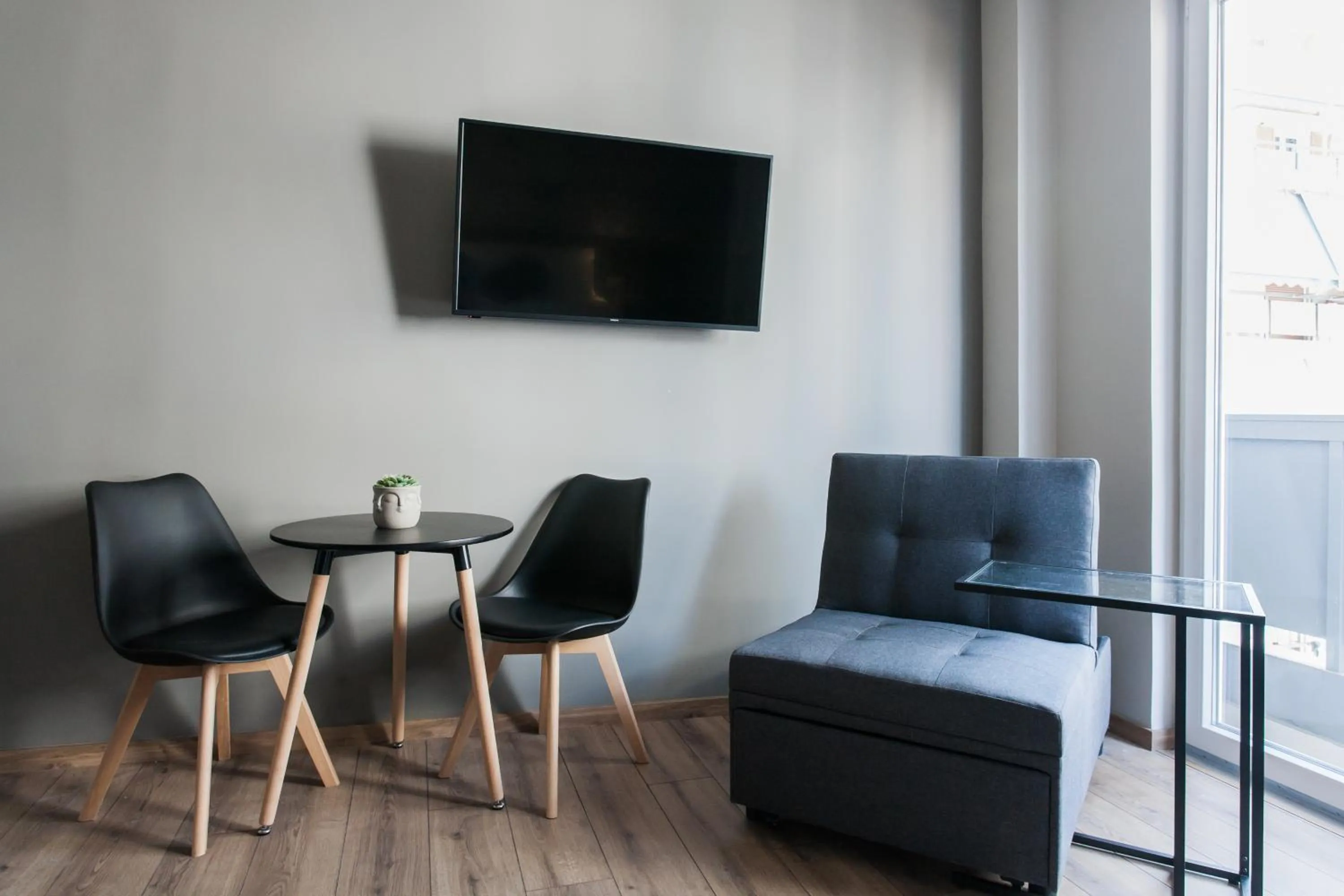 TV and multimedia in WYZ Athens Apartments by UPSTREET