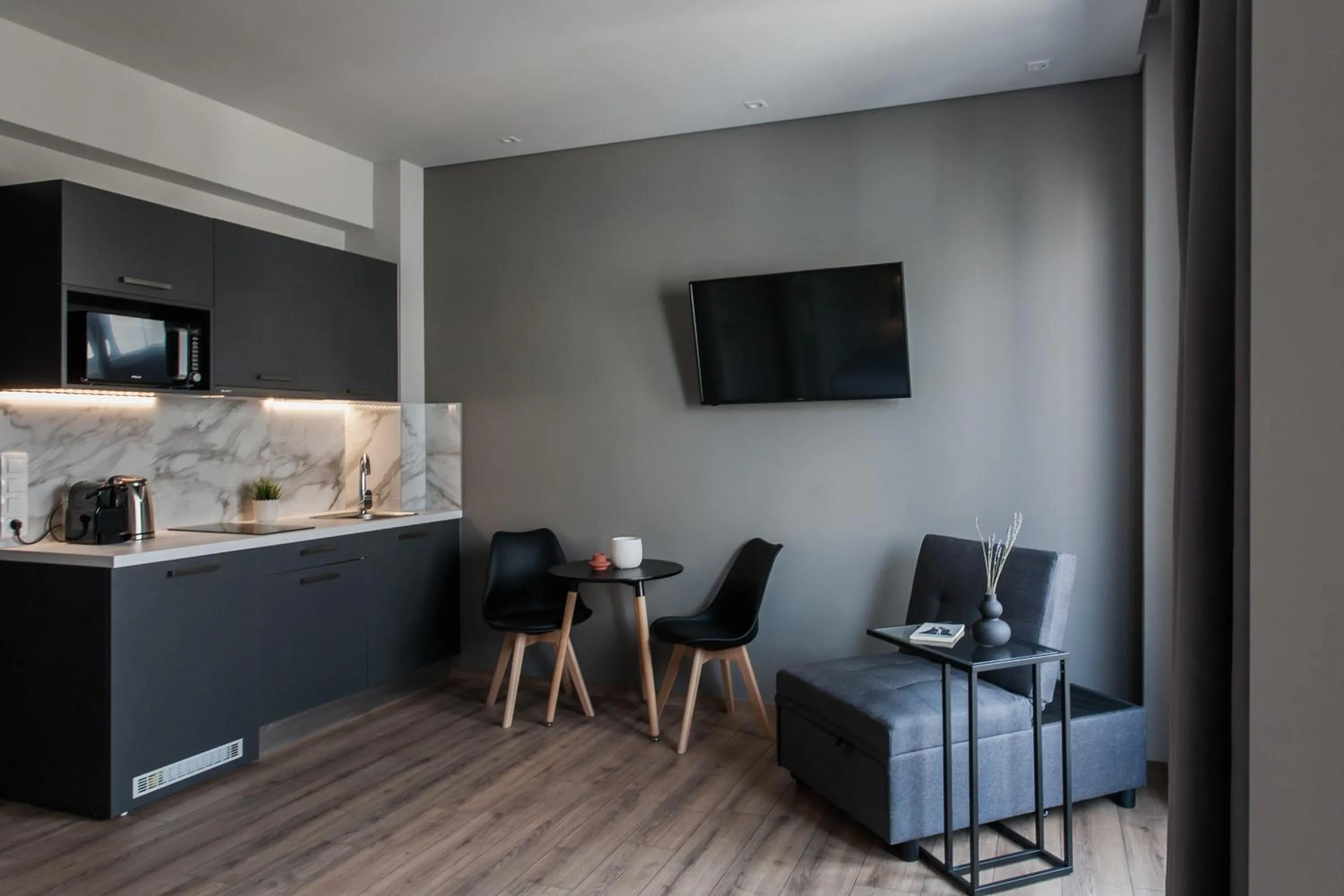 TV and multimedia in WYZ Athens Apartments by UPSTREET