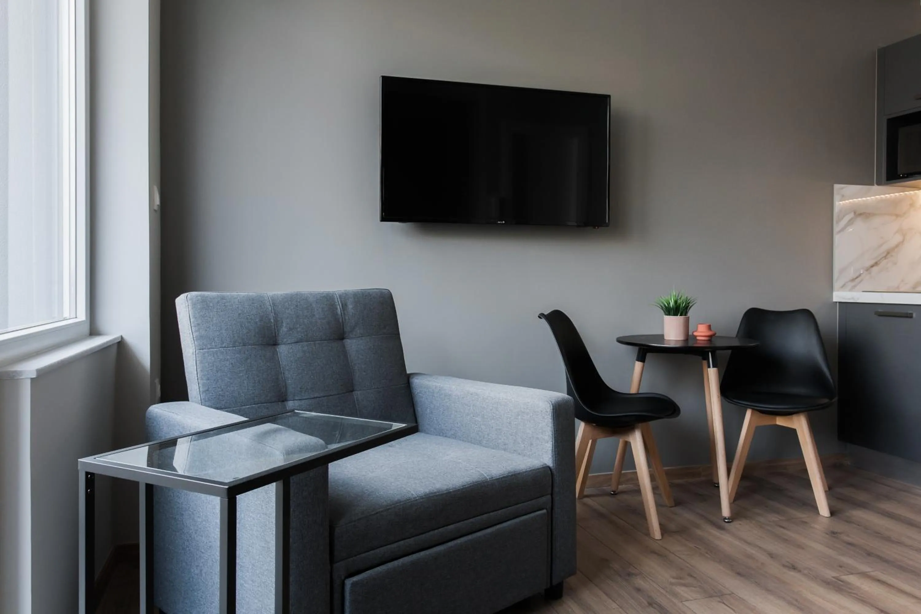 TV and multimedia in WYZ Athens Apartments by UPSTREET