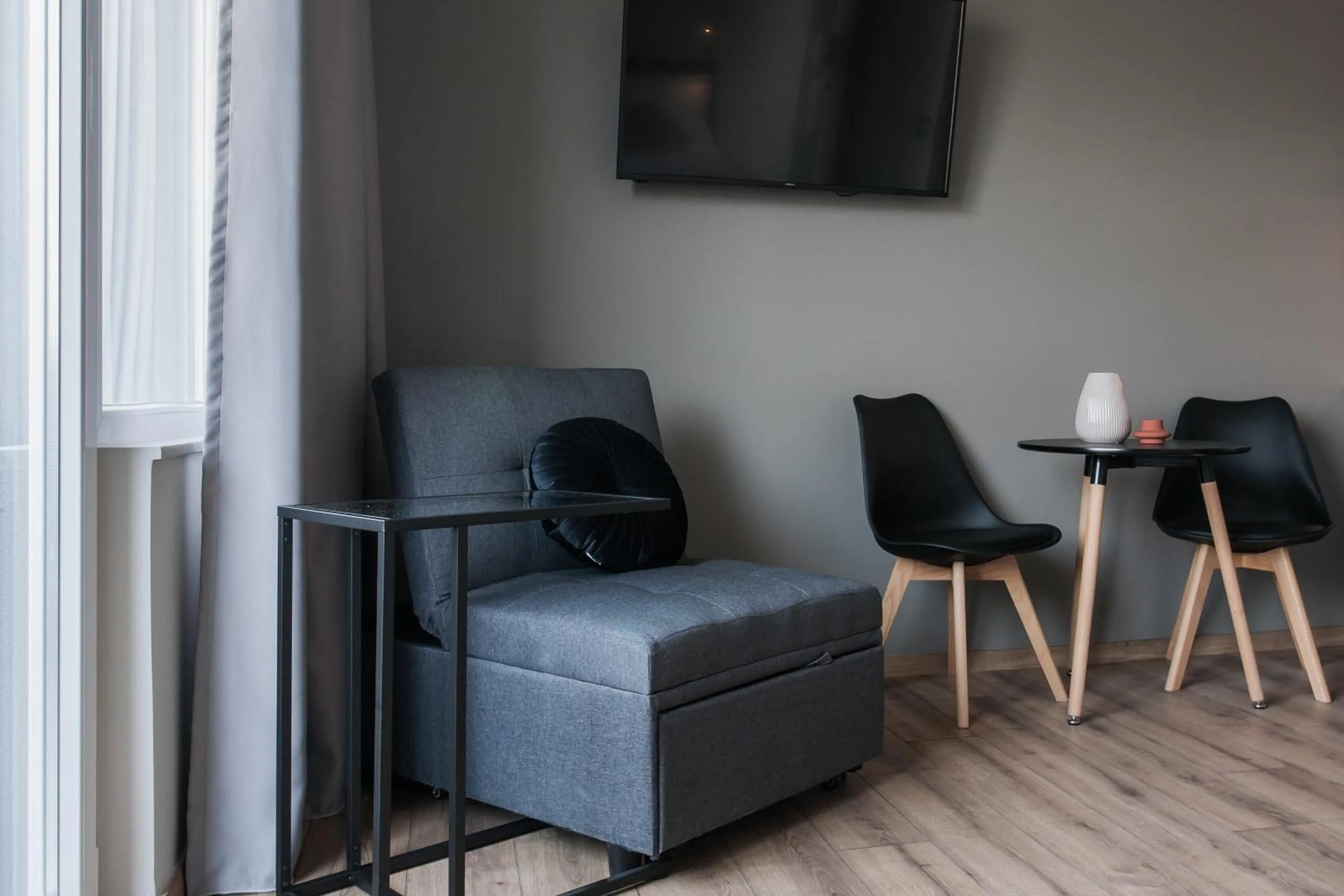 Seating area in WYZ Athens Apartments by UPSTREET