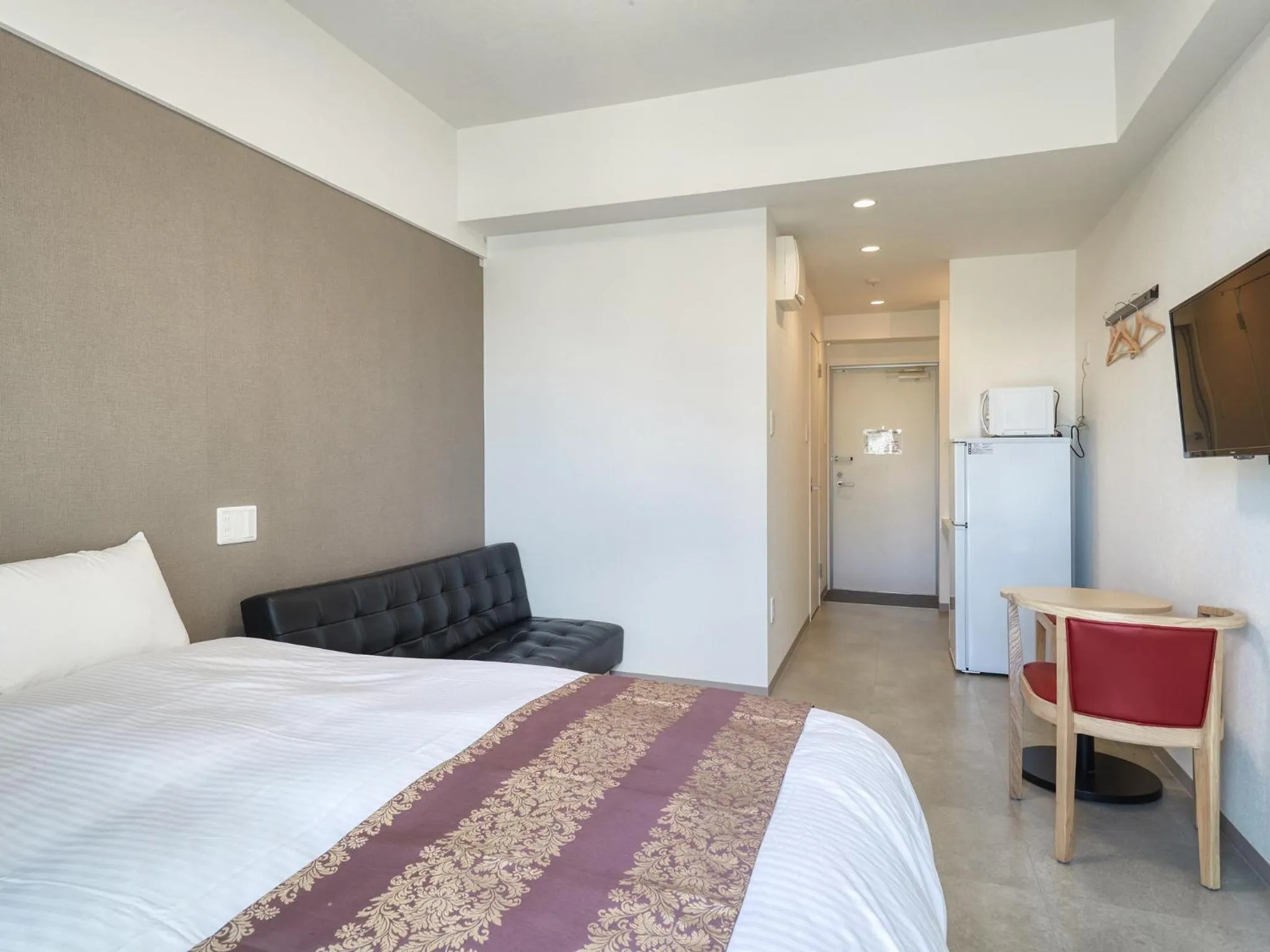 Photo of the whole room, Bed in BiBi Hotel NAHA KUME