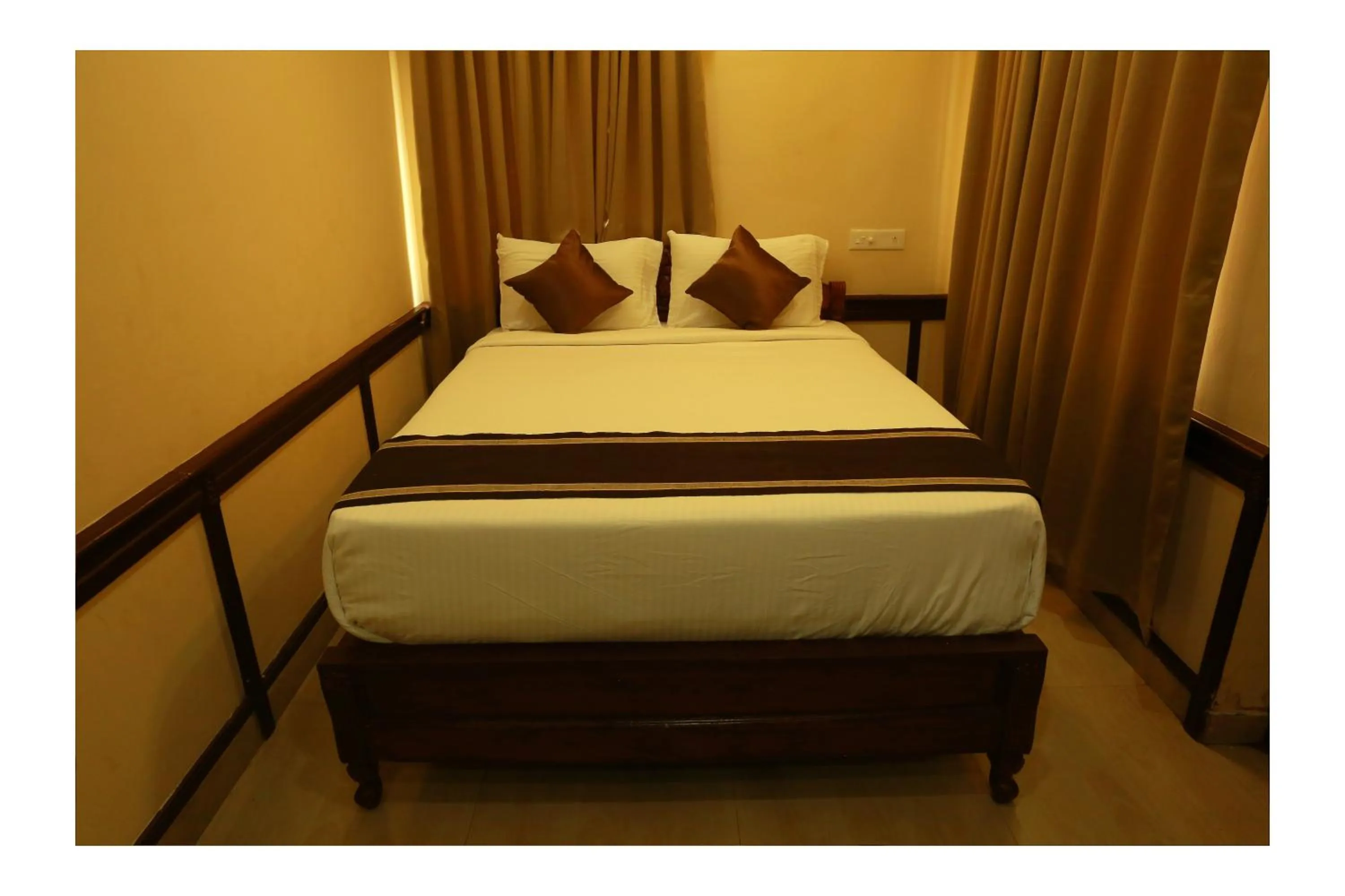 Bed in CORRIDOR CALICUT Airport Hotel