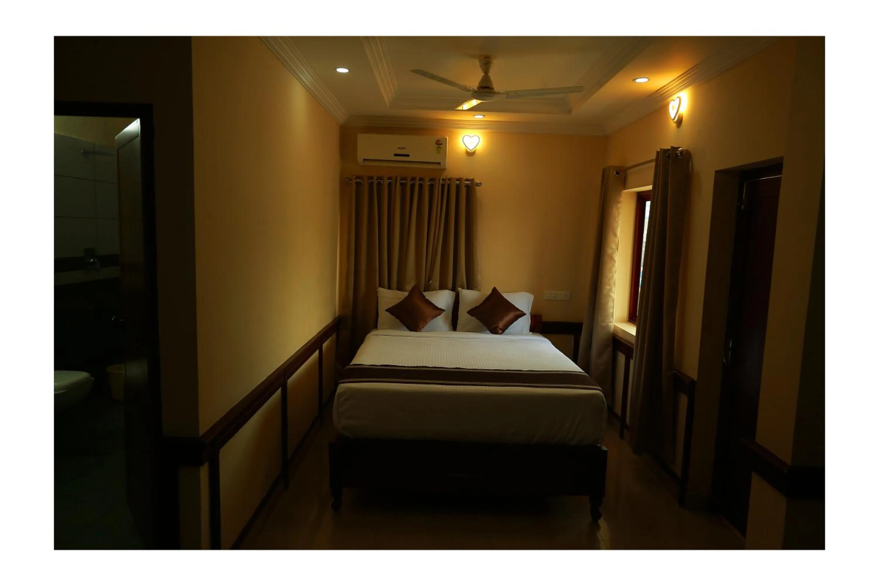 Bed in CORRIDOR CALICUT Airport Hotel