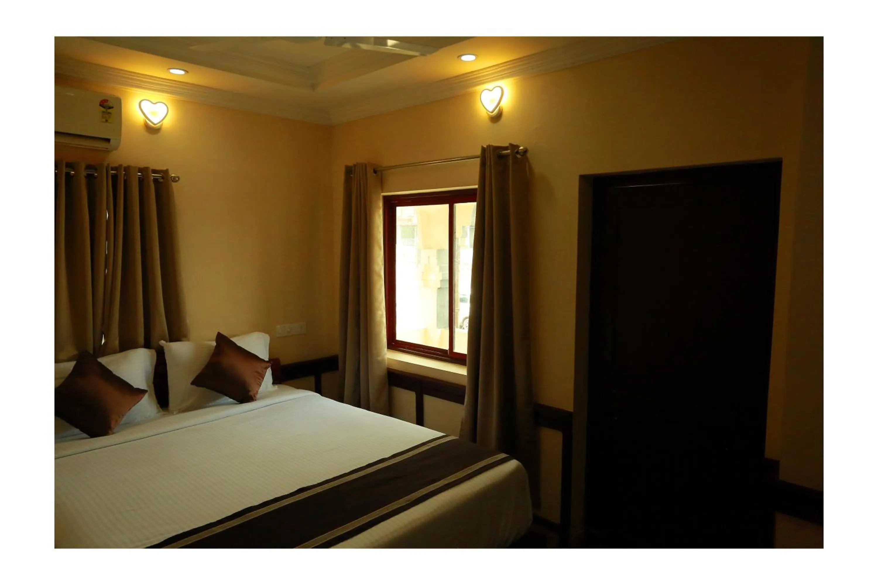 Bed in CORRIDOR CALICUT Airport Hotel