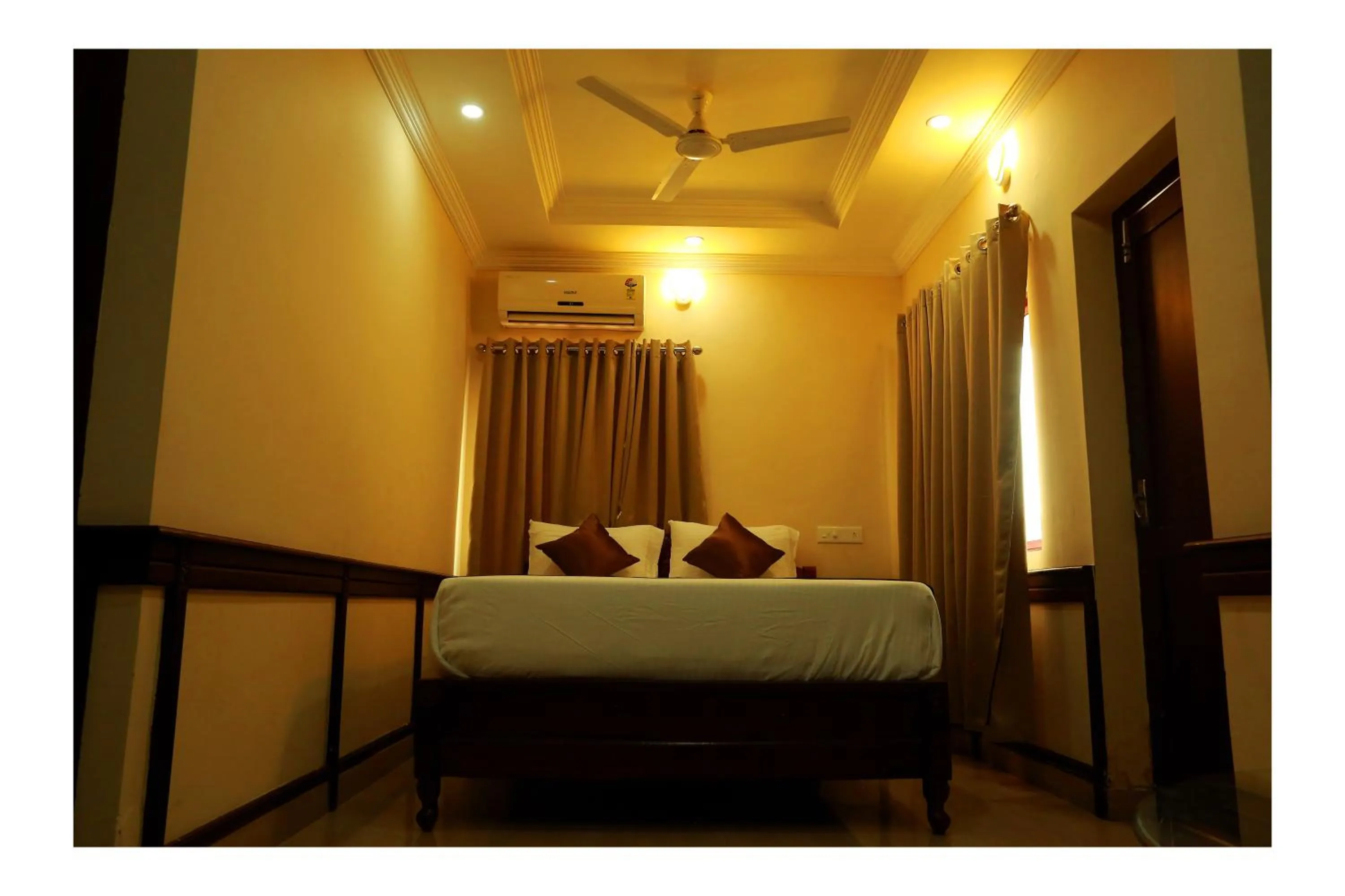 Bed in CORRIDOR CALICUT Airport Hotel