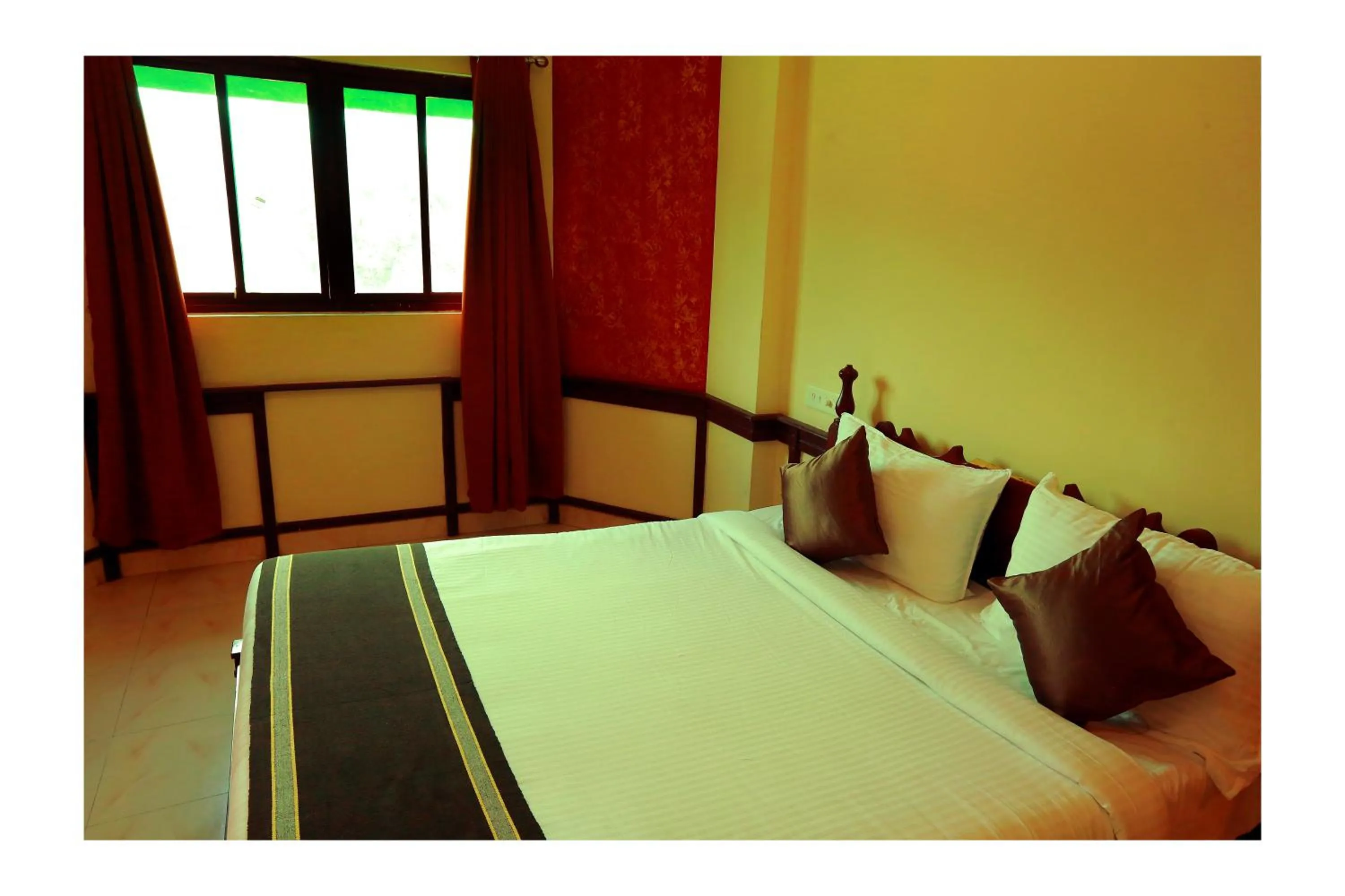 Bed in CORRIDOR CALICUT Airport Hotel