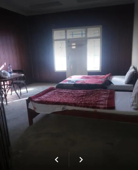 Bed in Happy Heart Hotel & Restaurant