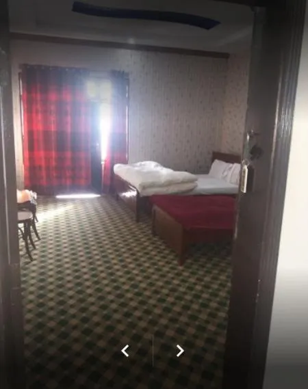 Bed in Happy Heart Hotel & Restaurant