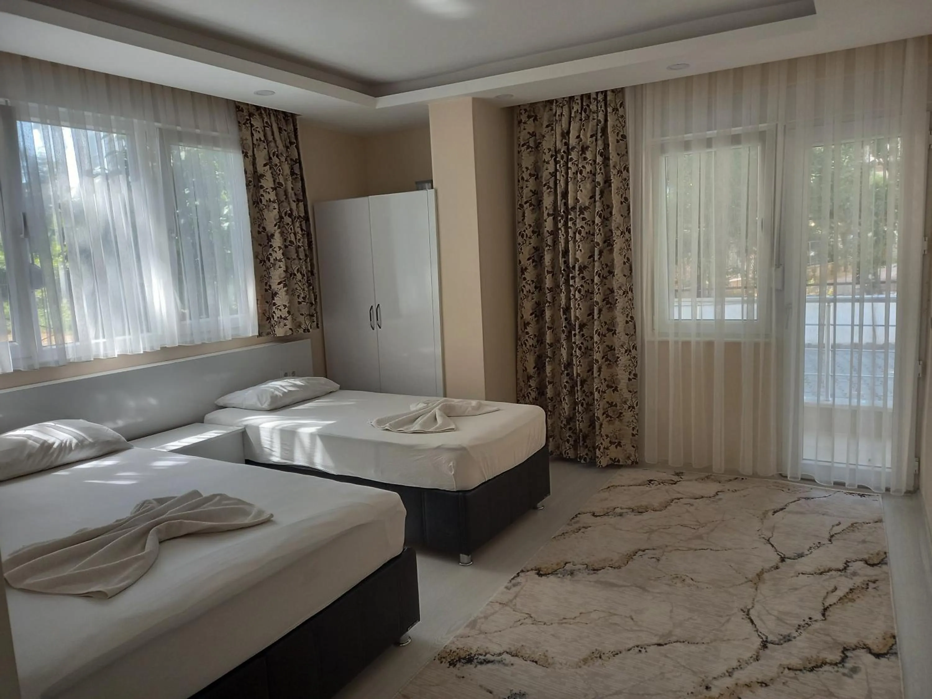 Bed in Ada APART&HOTEL
