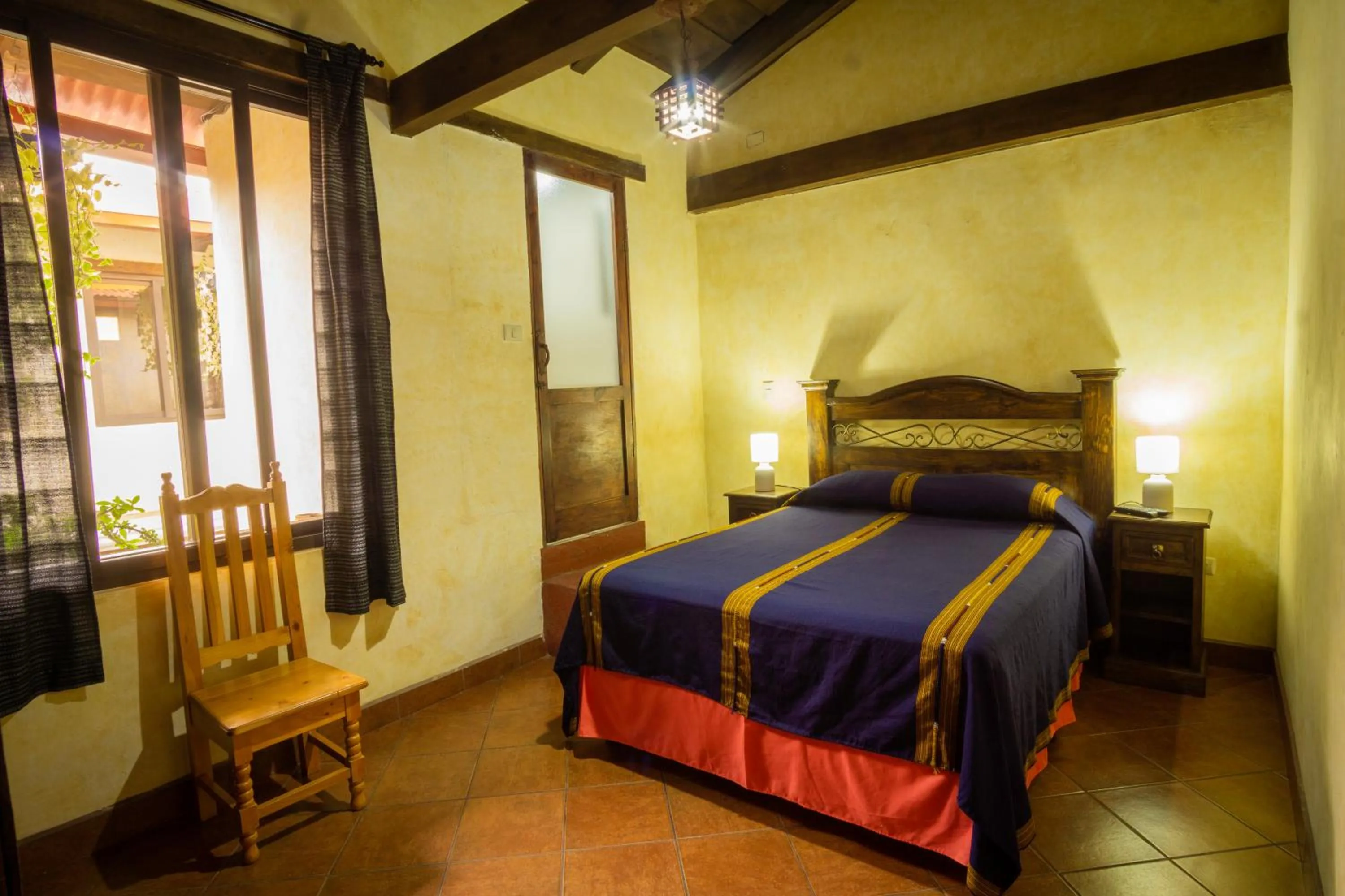 Bed in Hotel Maya Ik'