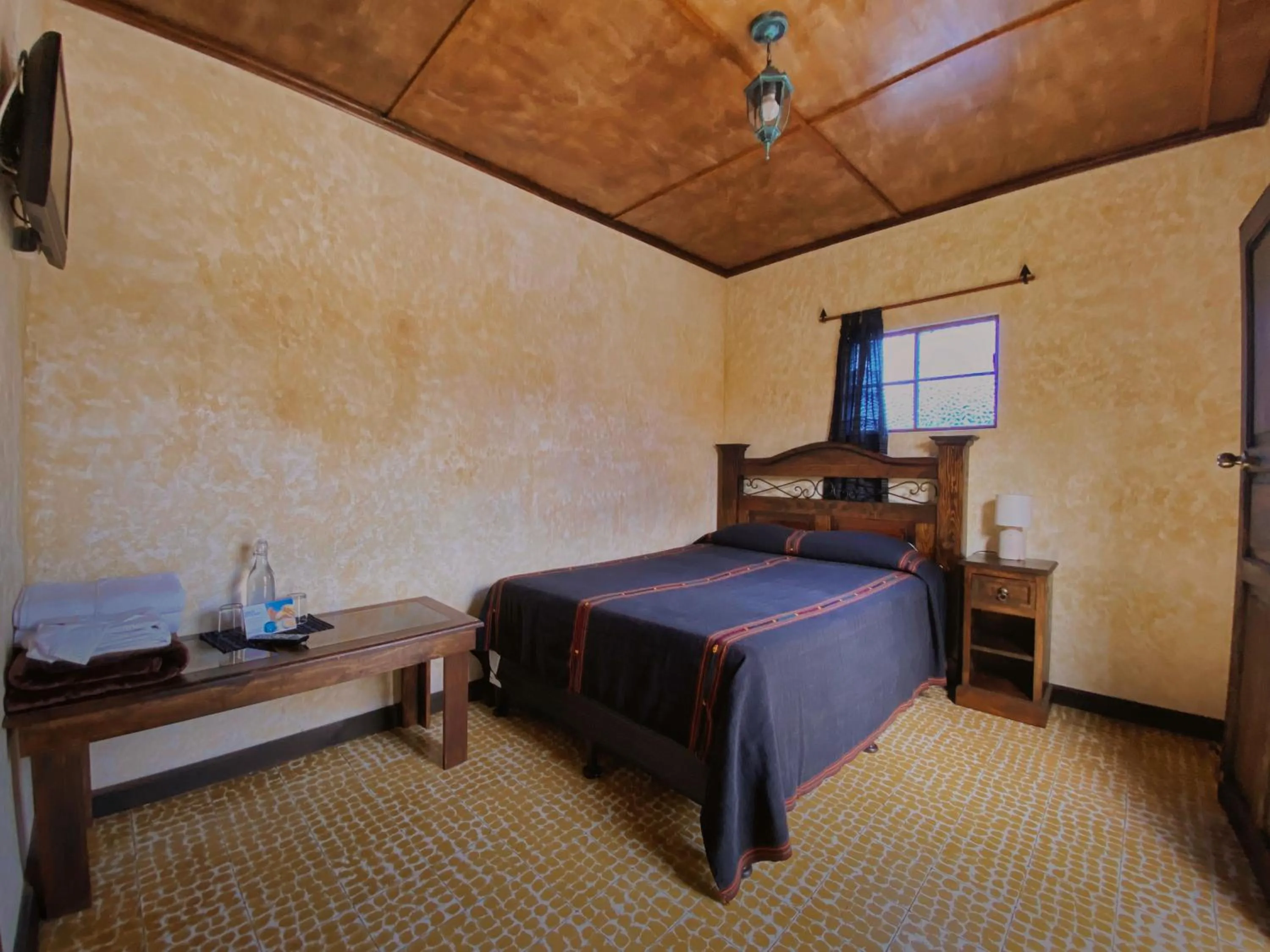 Bed in Hotel Maya Ik'