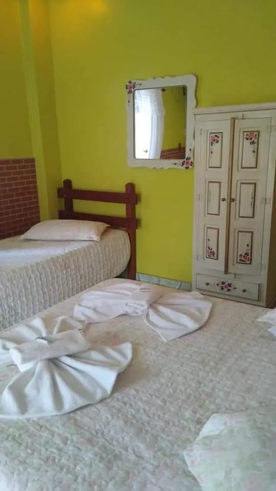 Bed in Pousada Oca Porã