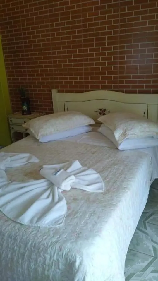 Bed in Pousada Oca Porã