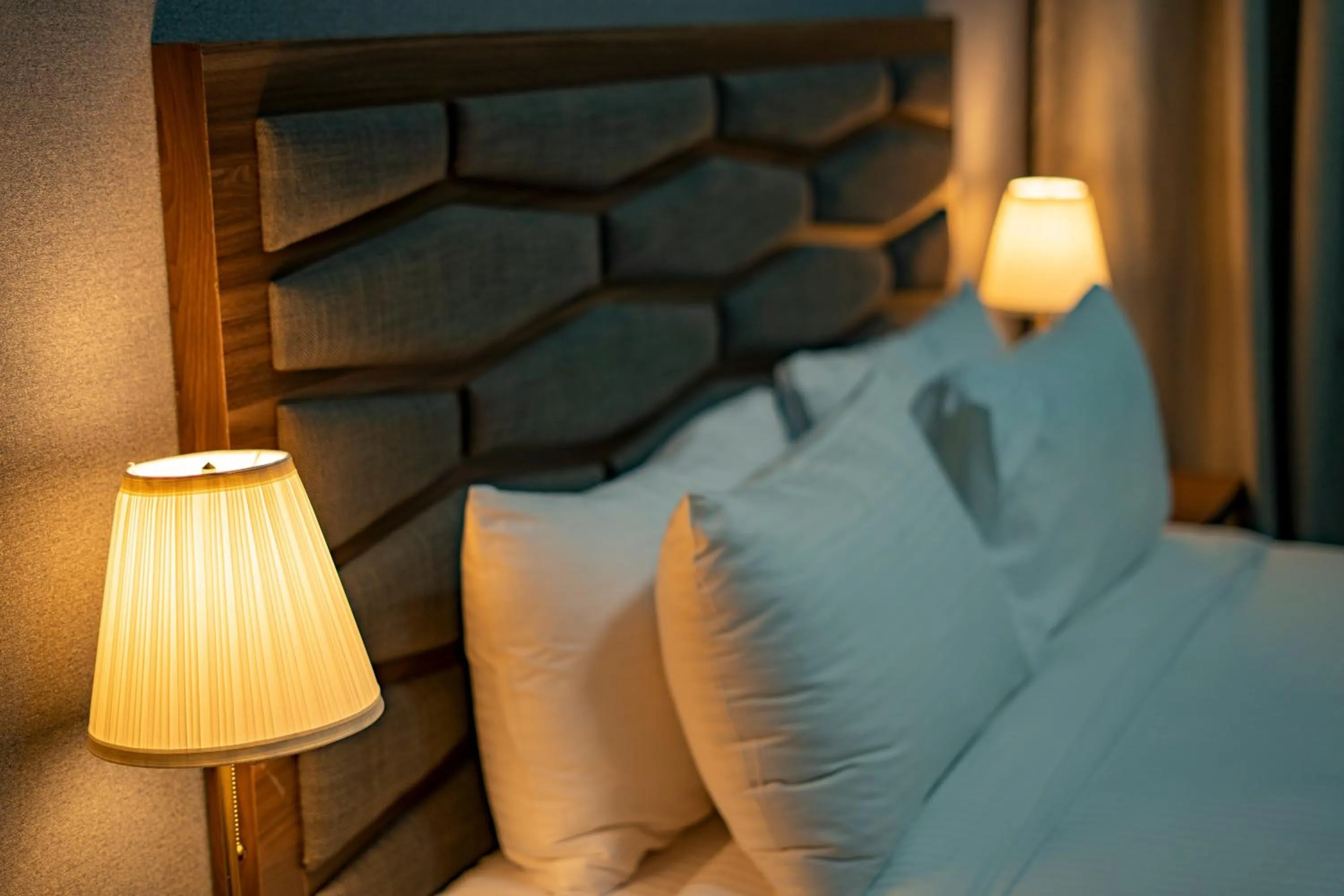 Bed in Luxe Grand Hotel Apartments