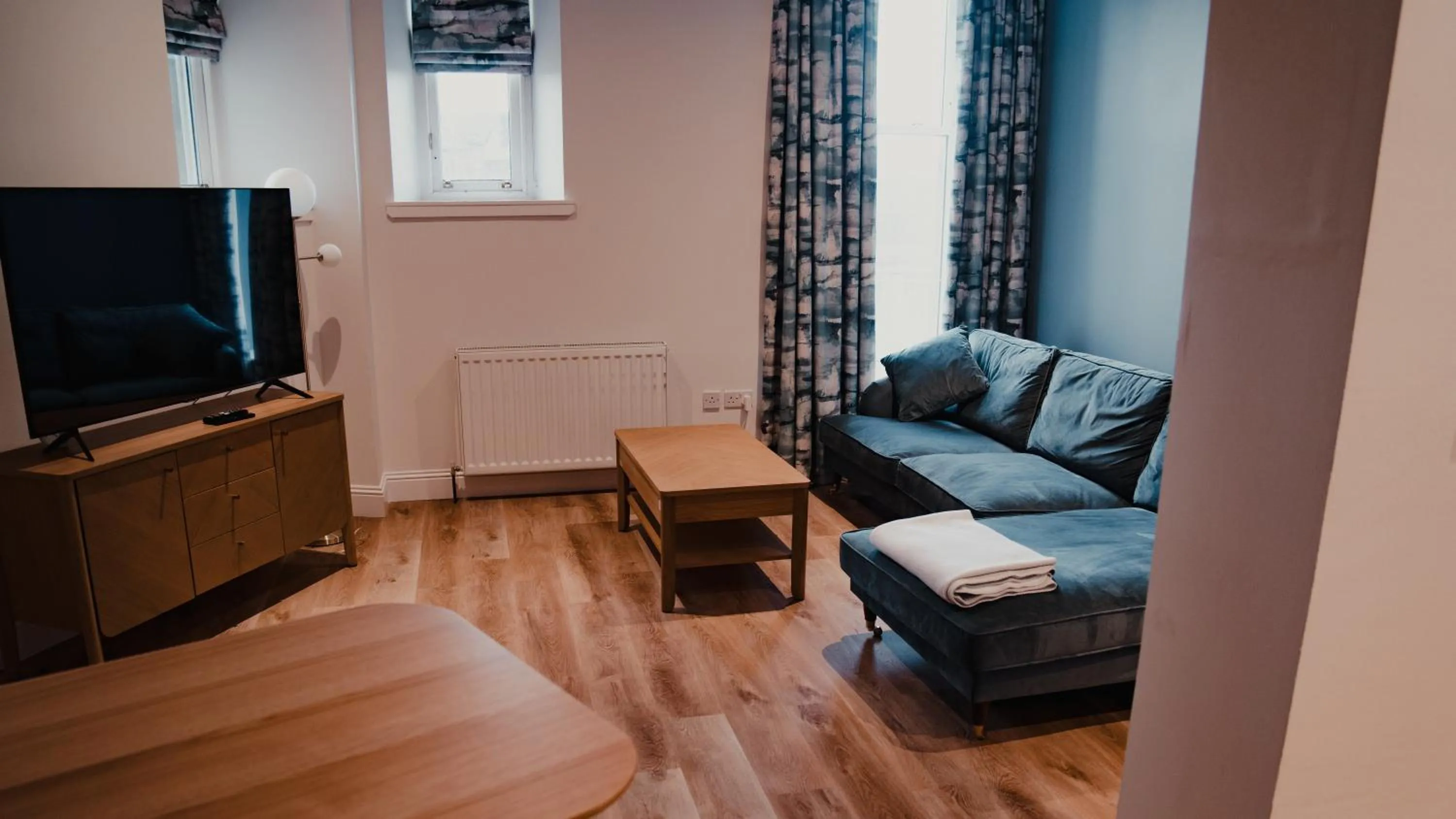 Communal lounge/ TV room in Royal Chambers Serviced Apartments