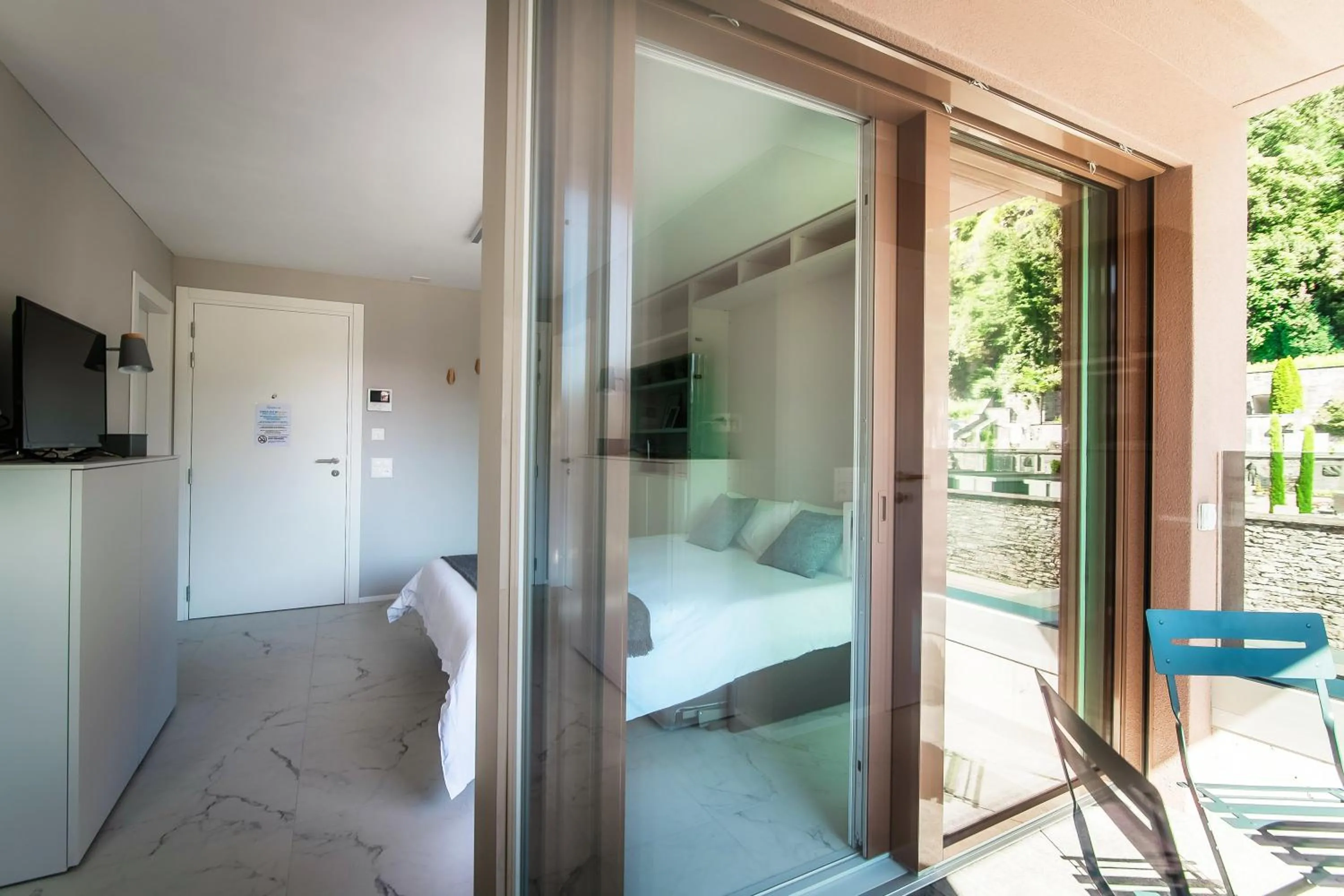 Photo of the whole room, Bed in Locarno Studios by Quokka 360 - in the centre of Locarno