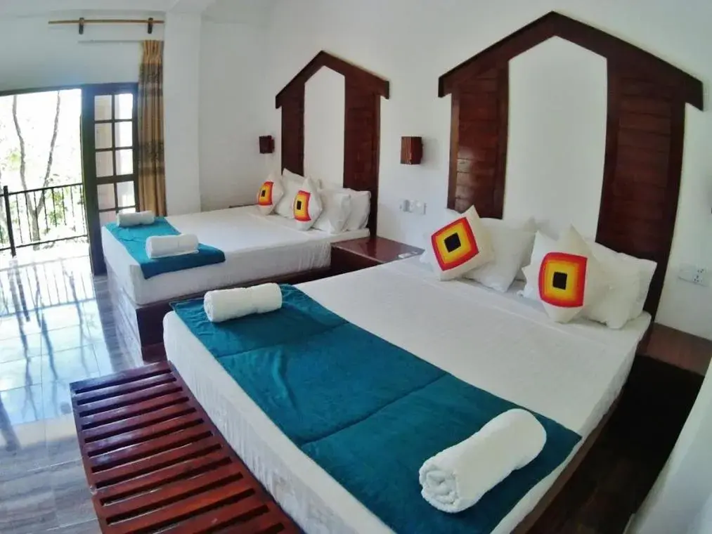 Bed in Sundaras Resort & Spa Dambulla Bed in Sundaras Resort & Spa Dambulla