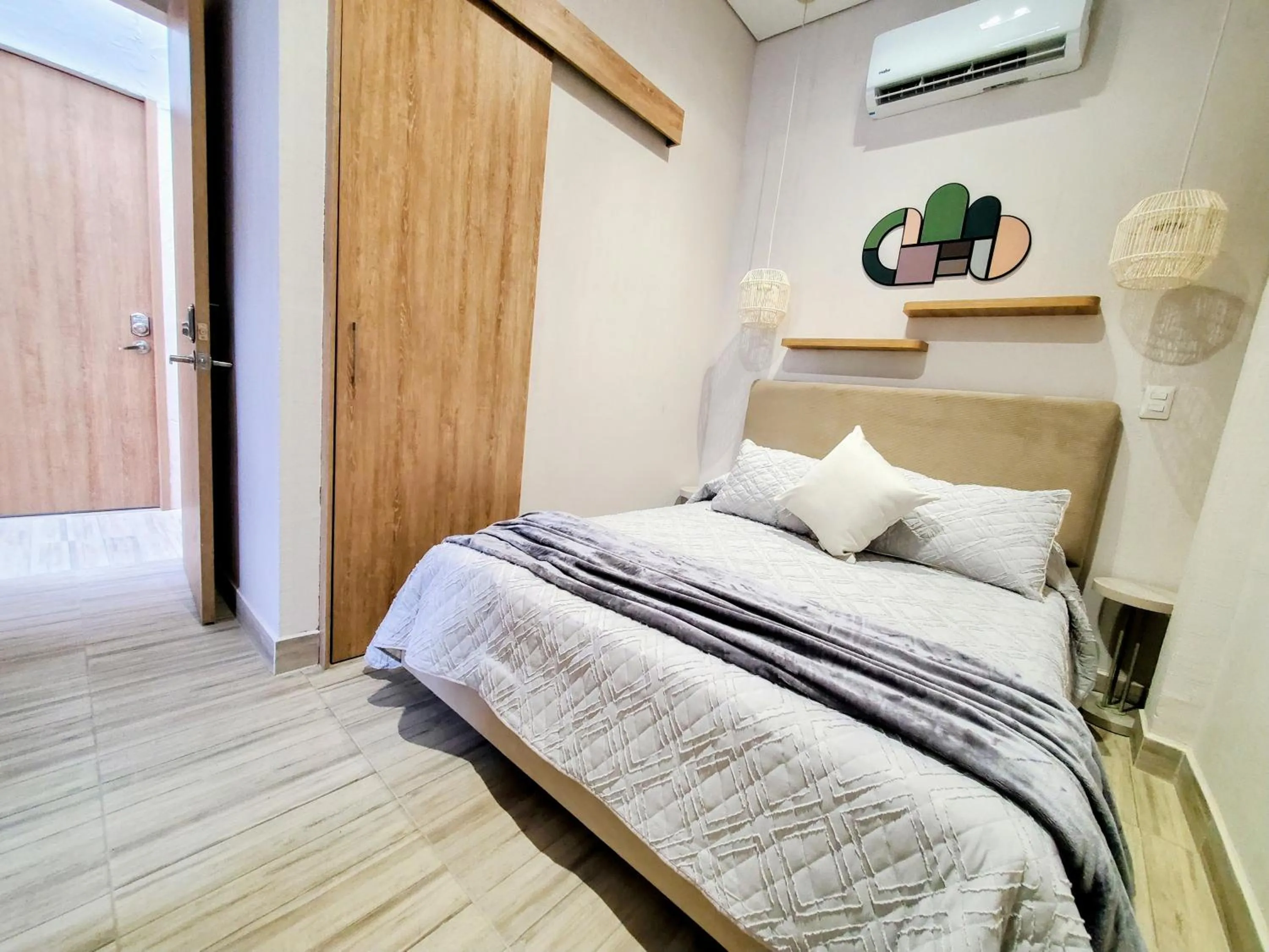 Photo of the whole room, Bed in Zentrico Boutique