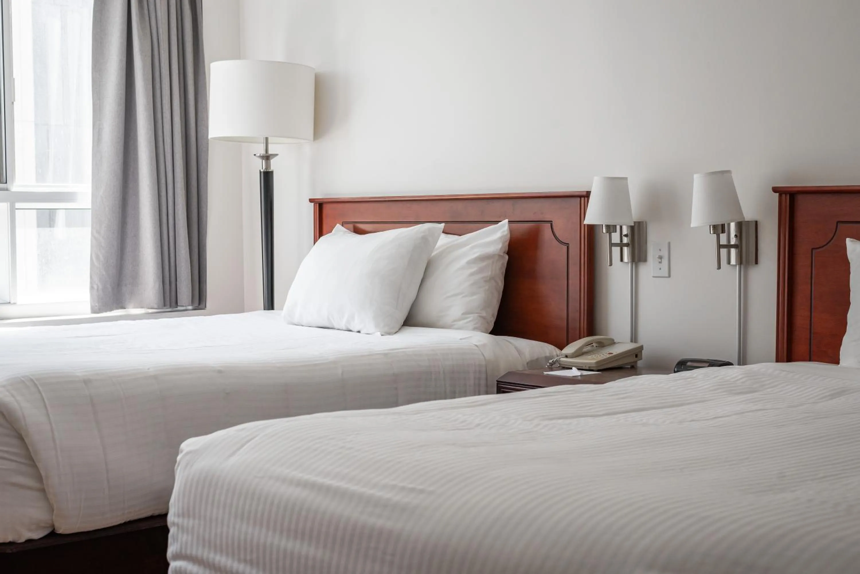 Bed in Hotel les Suites Labelle