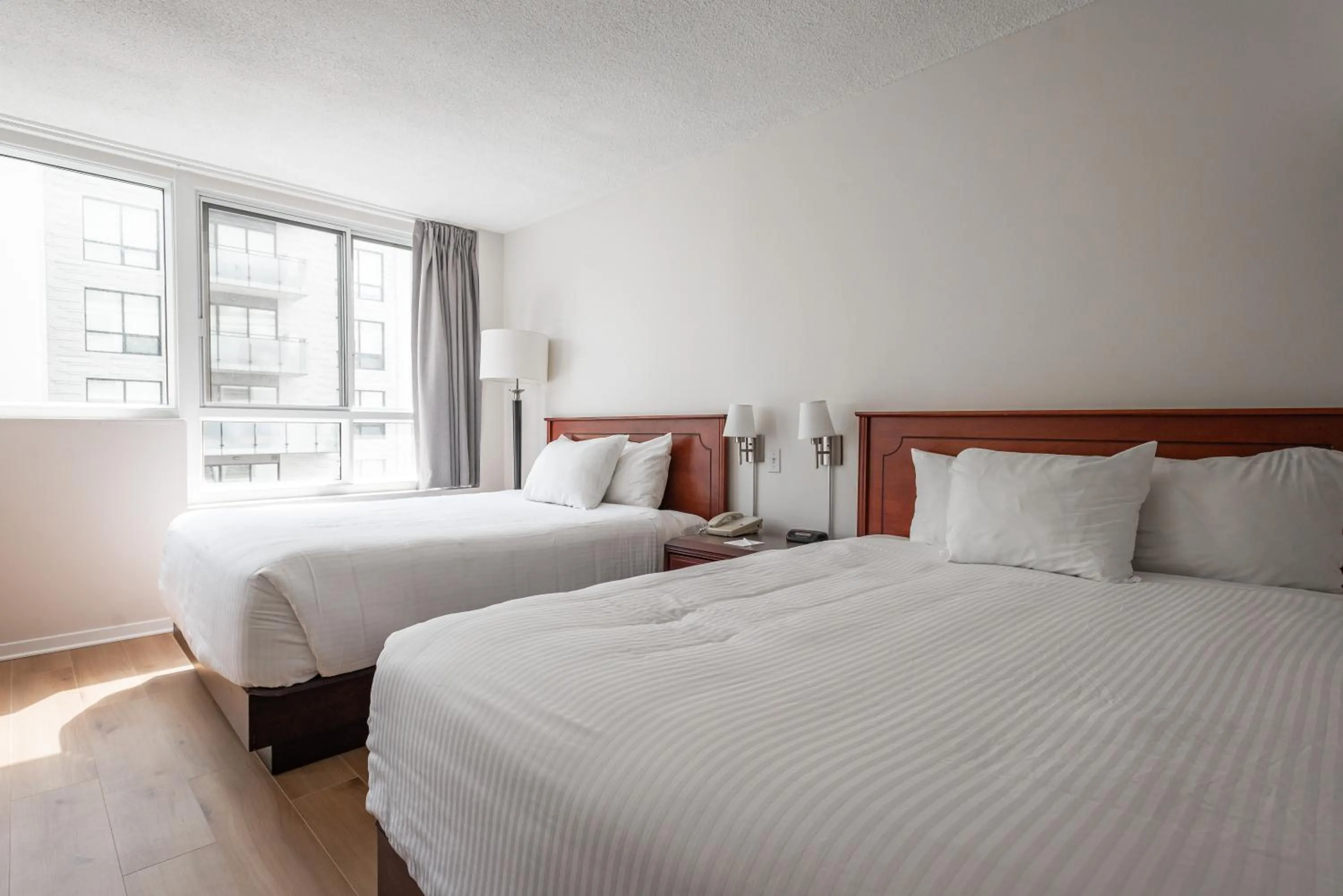 Bed in Hotel les Suites Labelle