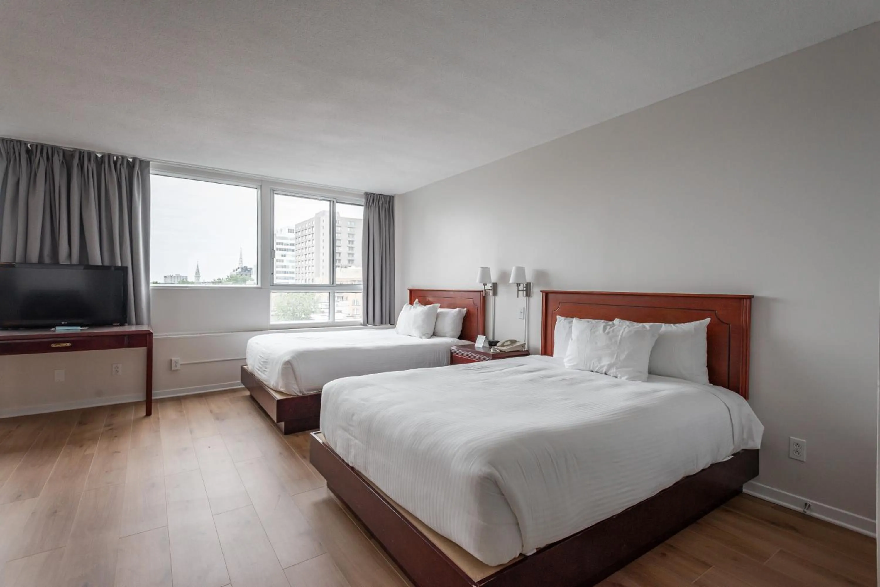 City view, Bed in Hotel les Suites Labelle