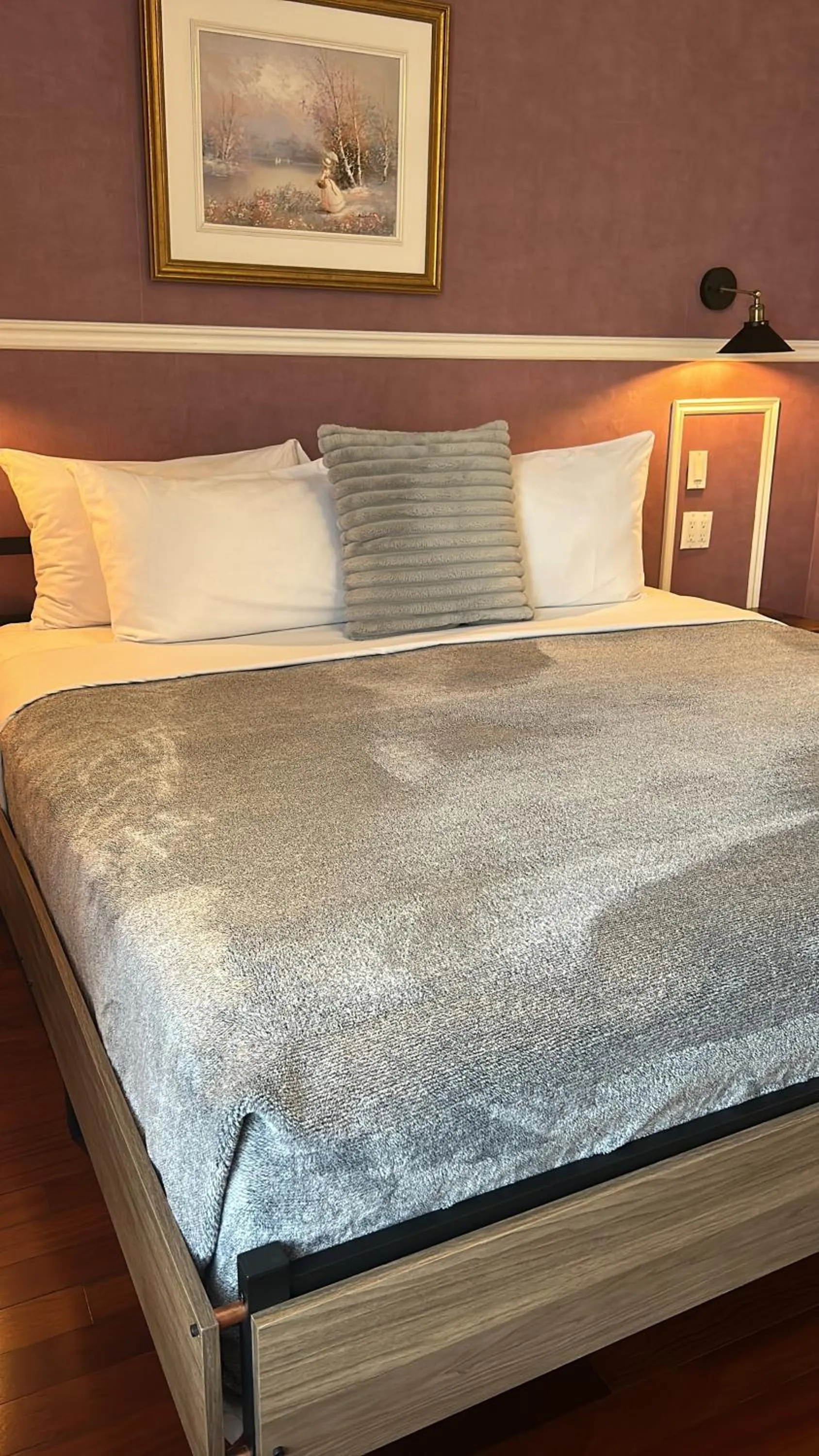 Bed in Parc Suites Hotel