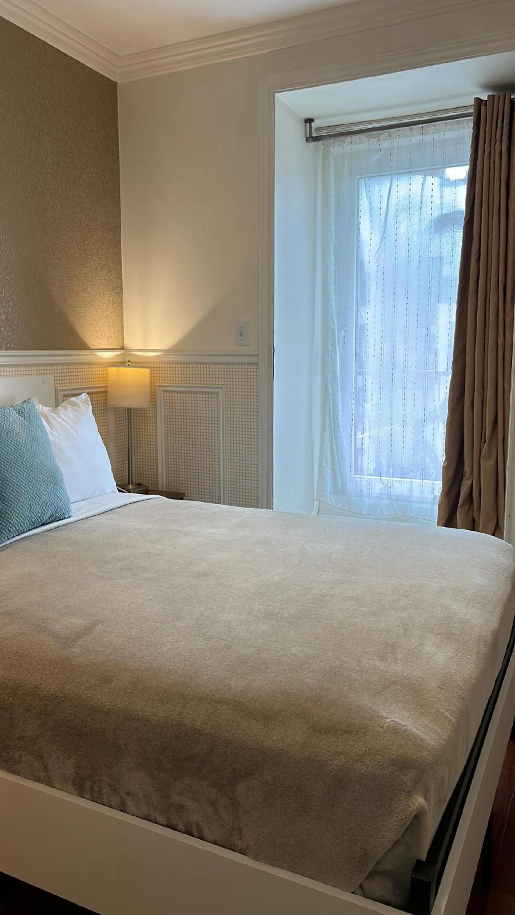 Bed in Parc Suites Hotel